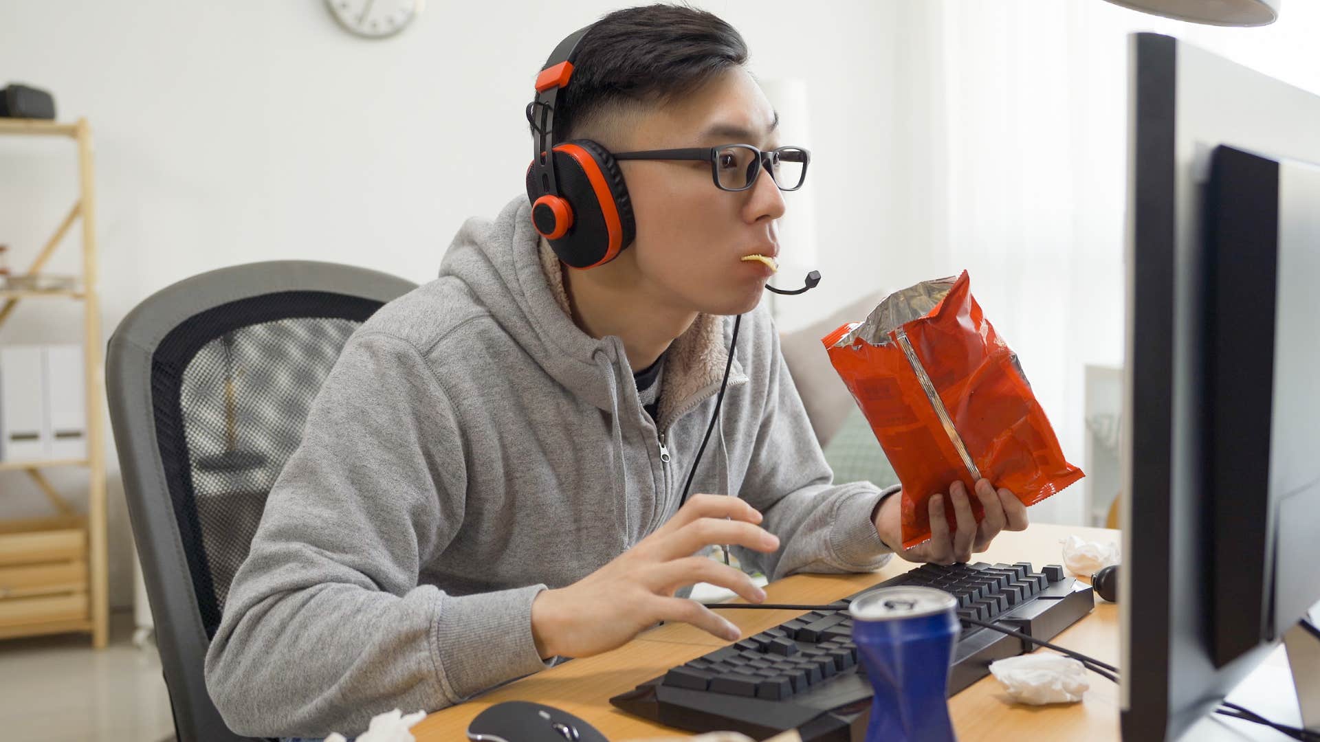 Man eating and buying individually packaged foods.