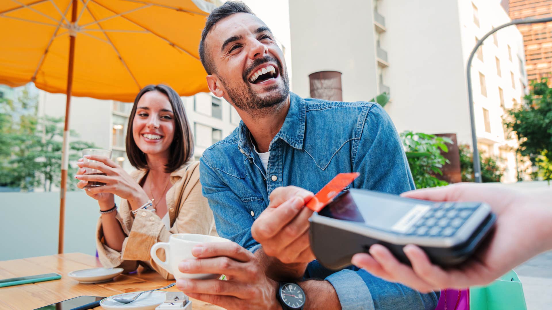 Man who's never saving money spending at a restaurant.