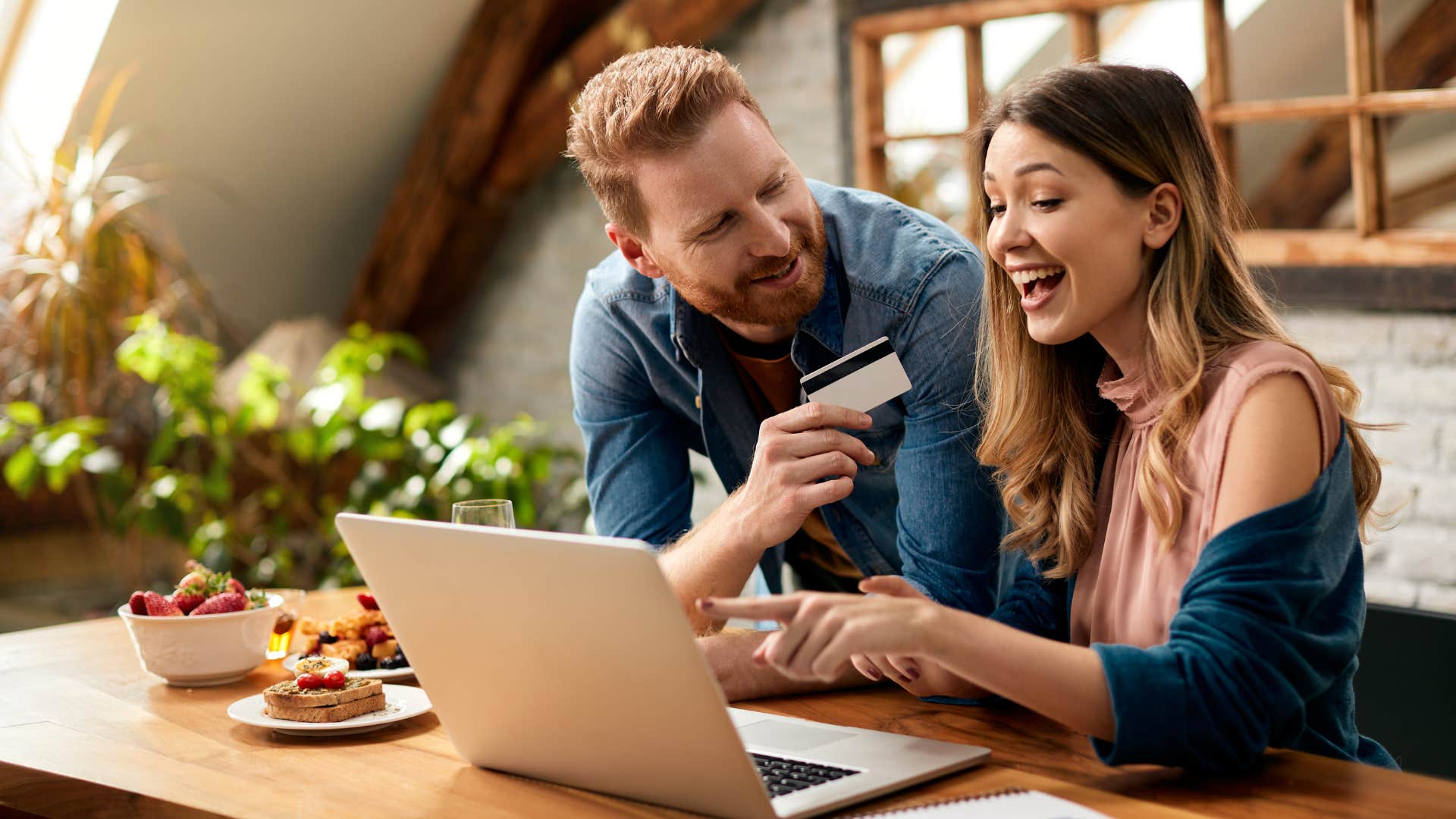 Couple smiling and spending more on convenience online.