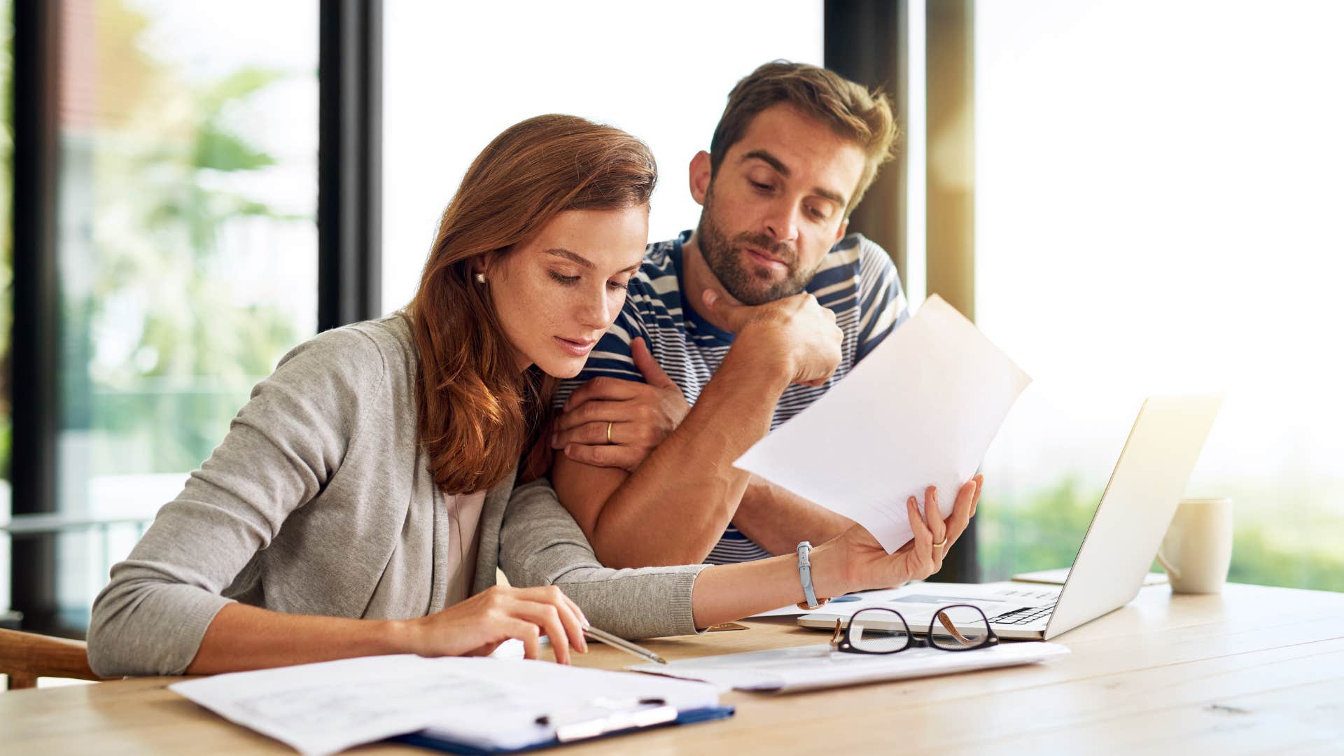 a wife tells her husband how she has been lowering the energy bills in secret
