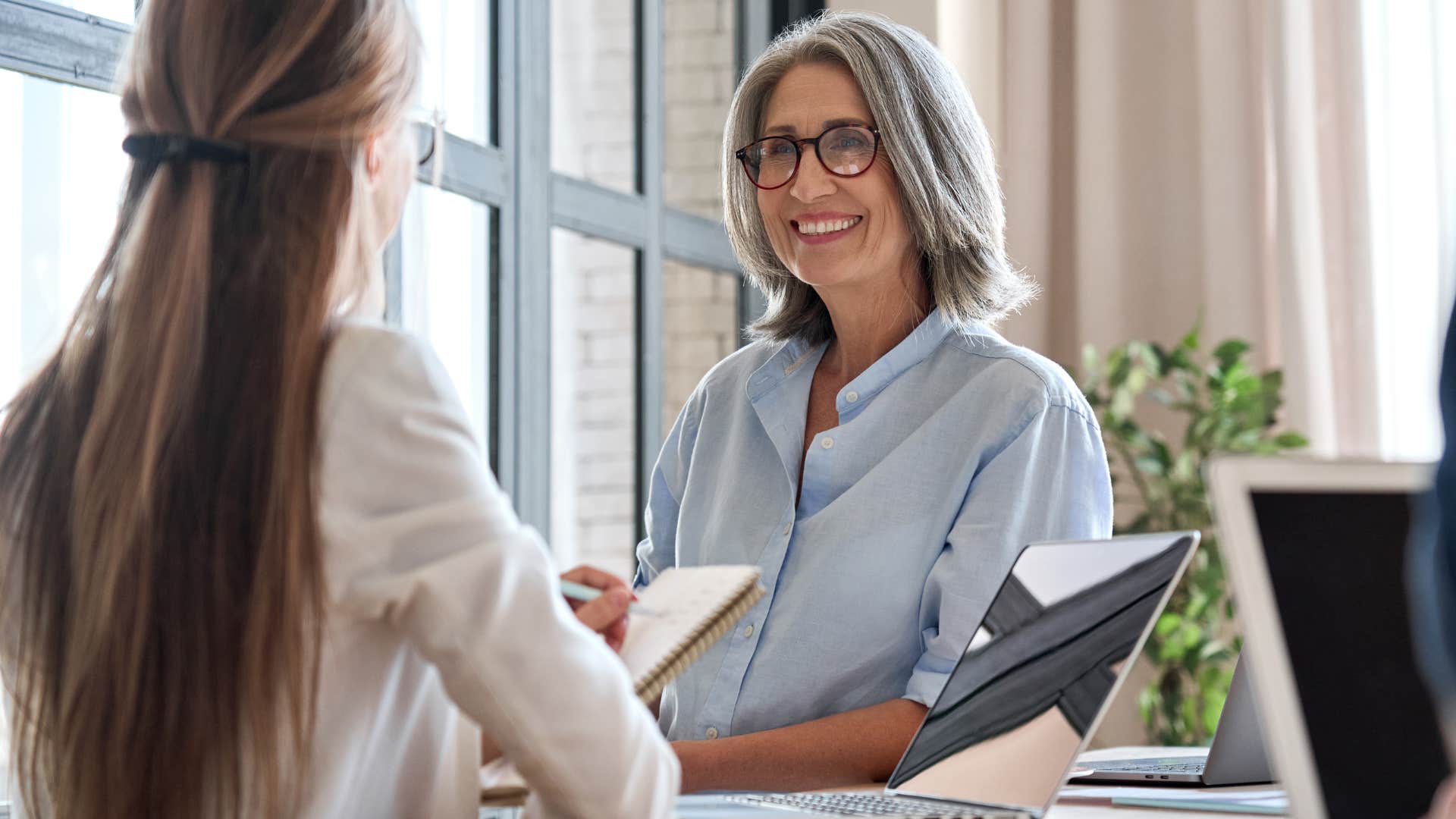 Woman scheduling meetings instead of sending an email at work.