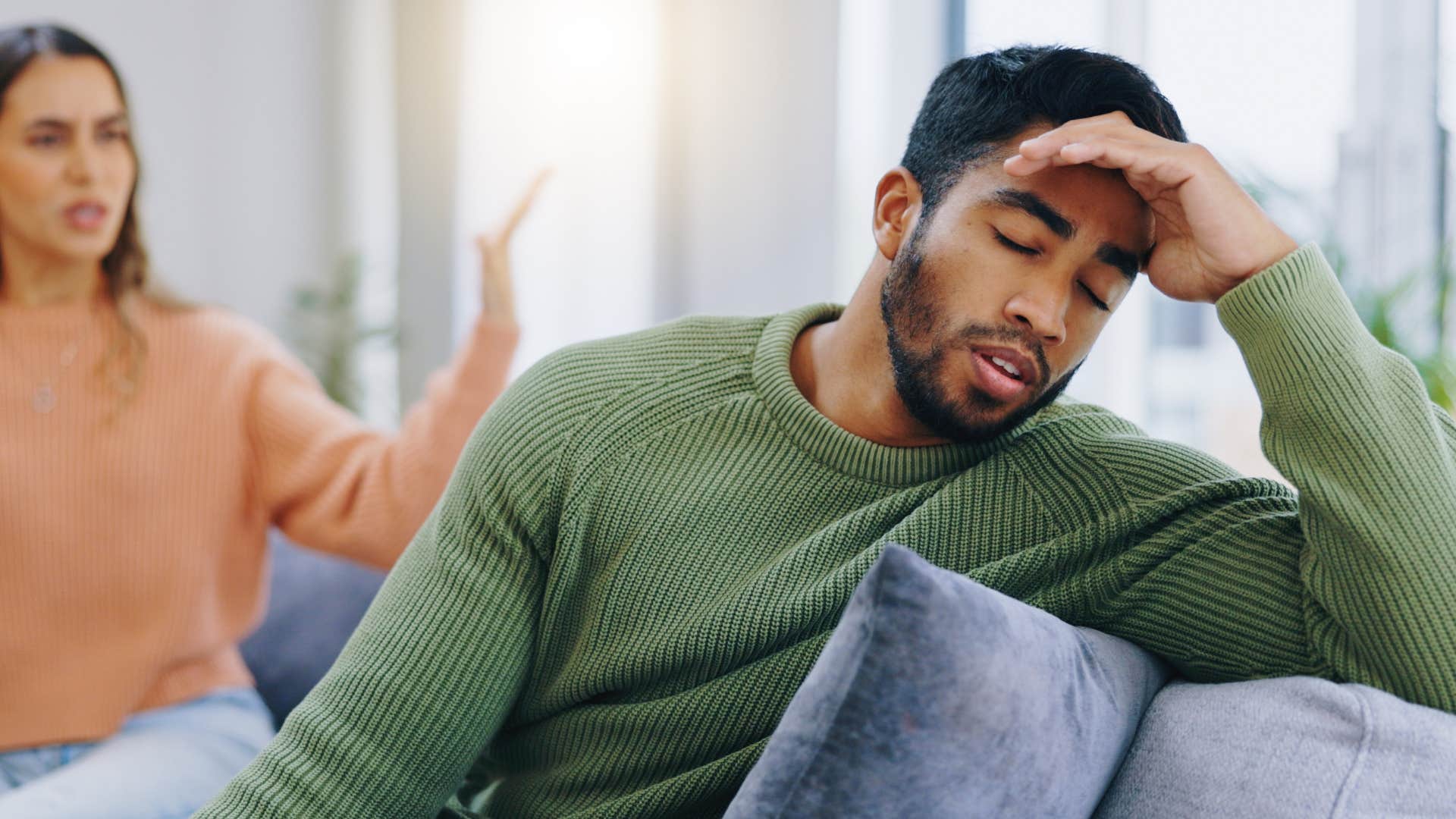 Man who's never apologizing turned away from his partner.