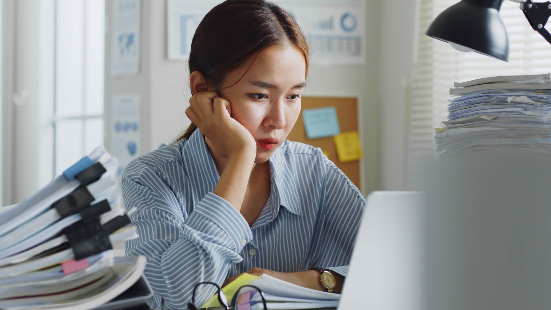 Woman staying busy 24/7 in her office.