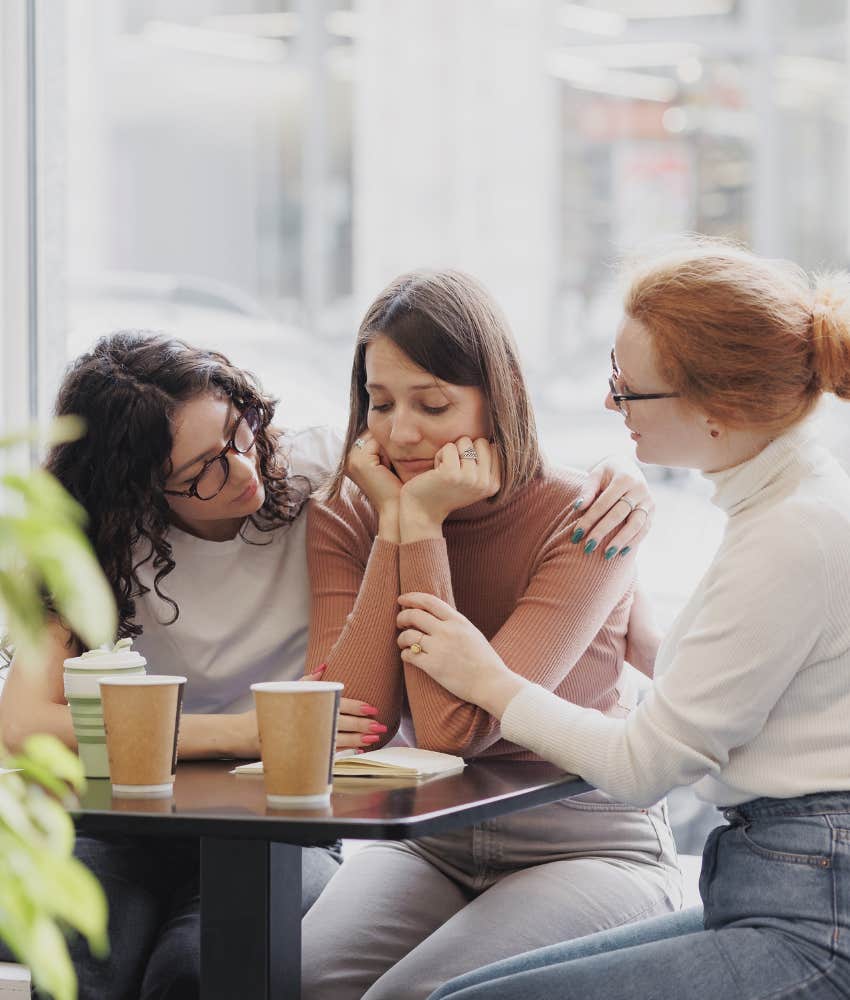 guilt-prone friend being comforted because she is trustworthy