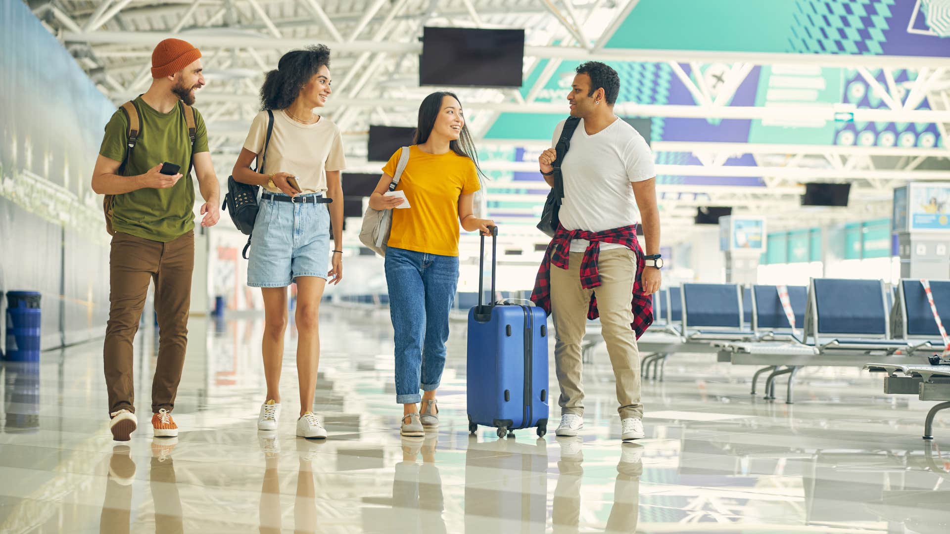 a woman talks to a complete stranger at the airport because she is a people pleaser