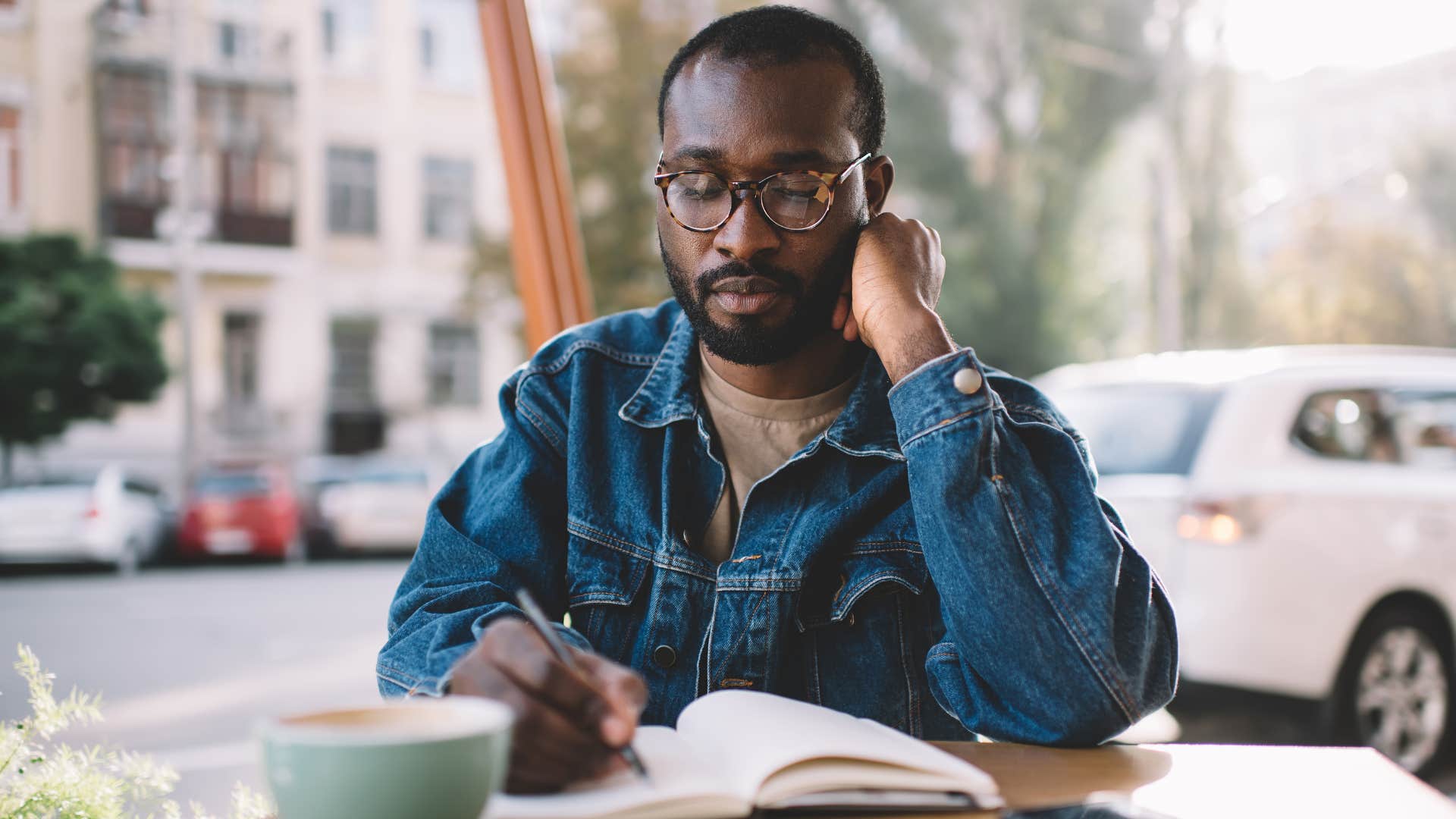 Person takes notes to wake up happier