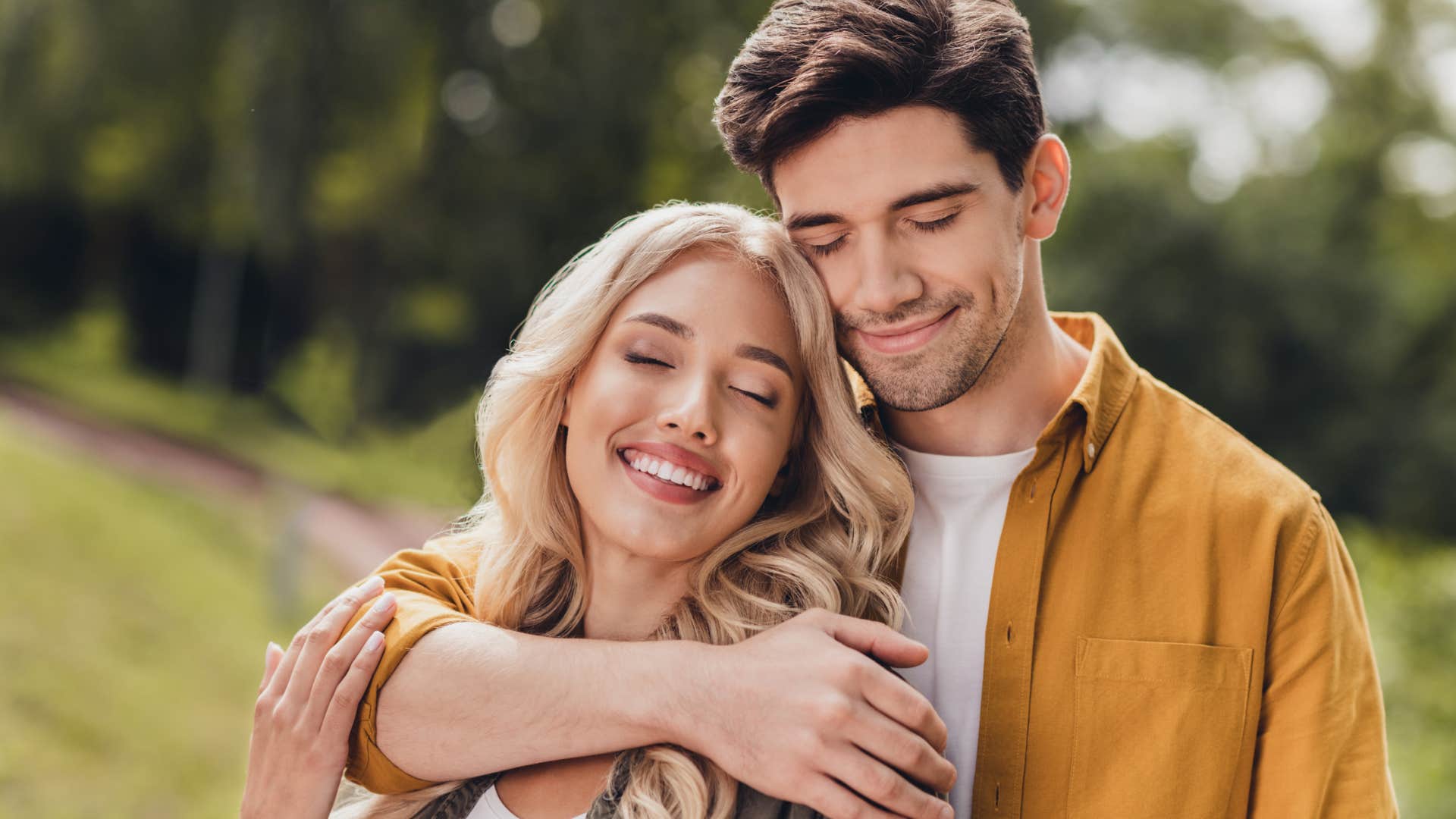 woman feeling at home with husband hugging
