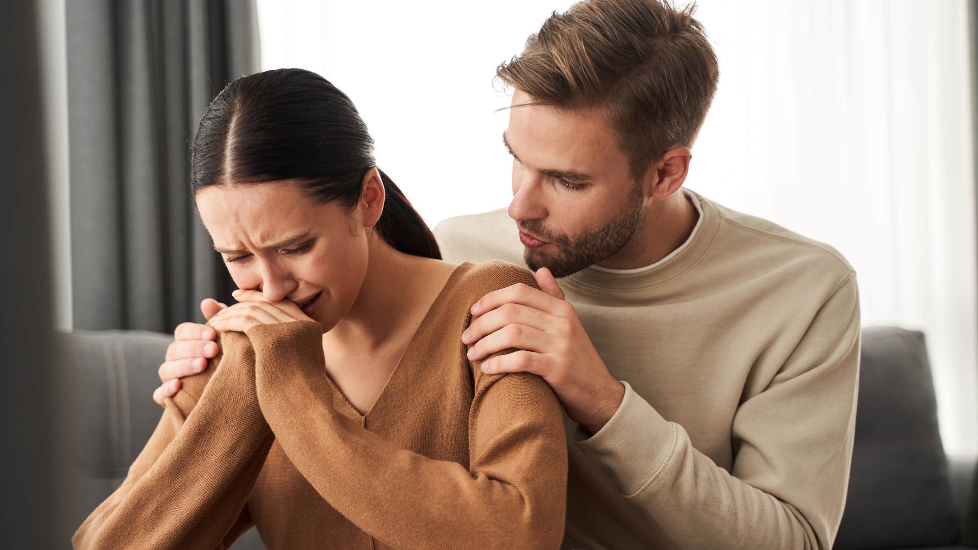 husband genuinely apologizing to wife