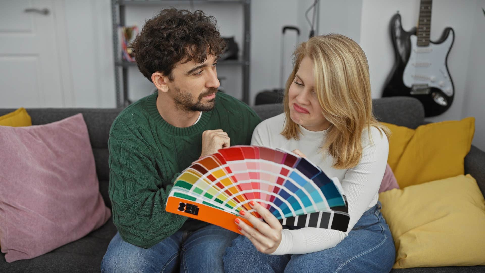 couple picking out vibrant colors for their home as their decor doesn't have a theme
