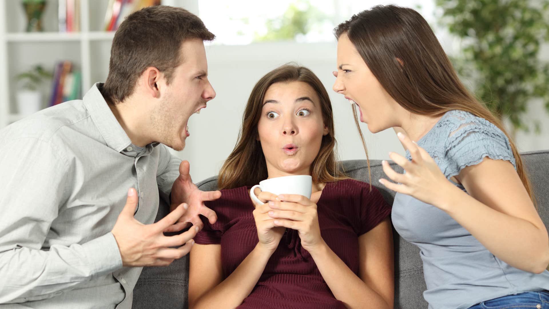 woman feeling awkward during tense couple argument