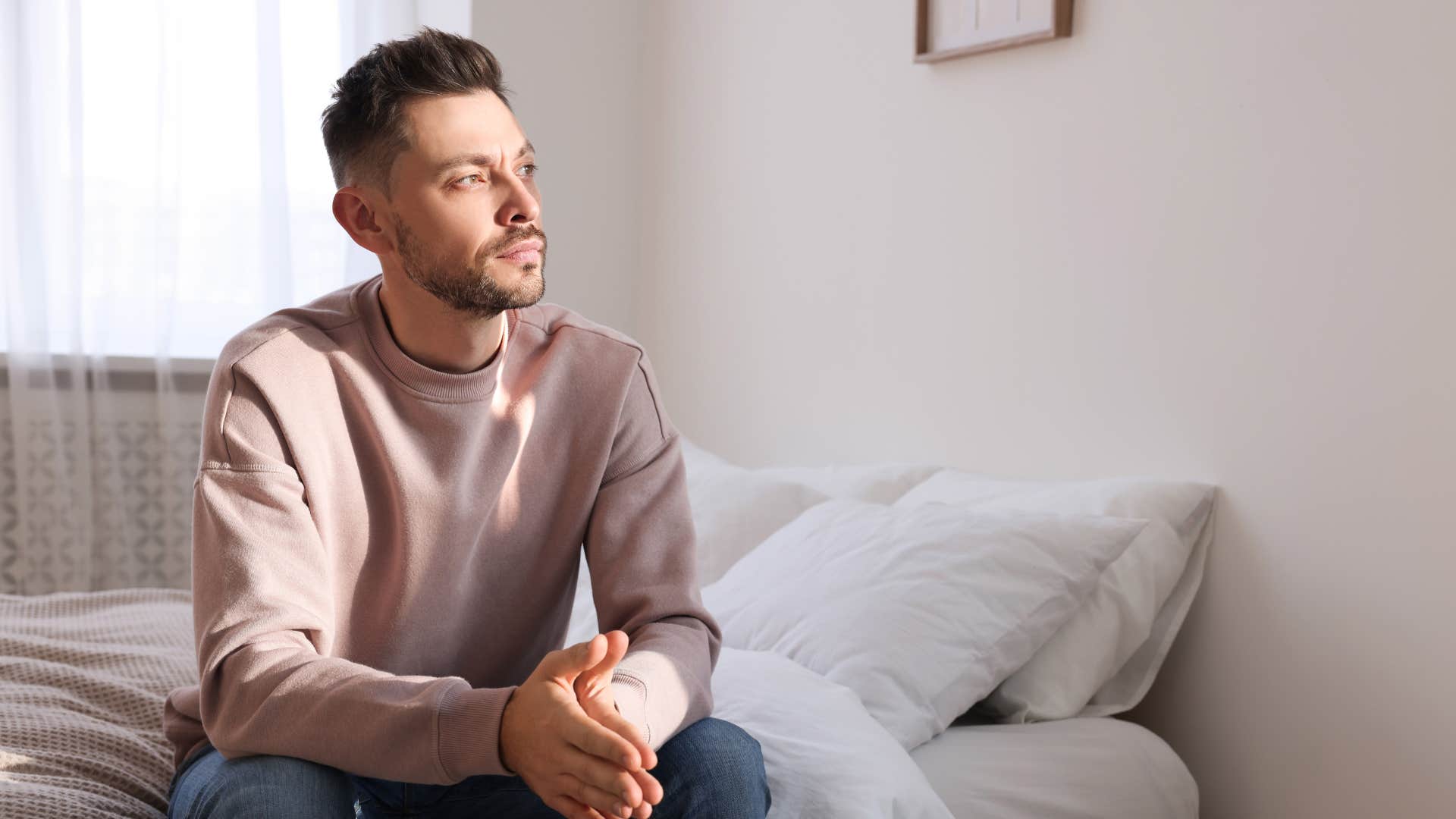 man sleeping in a different room away from partner