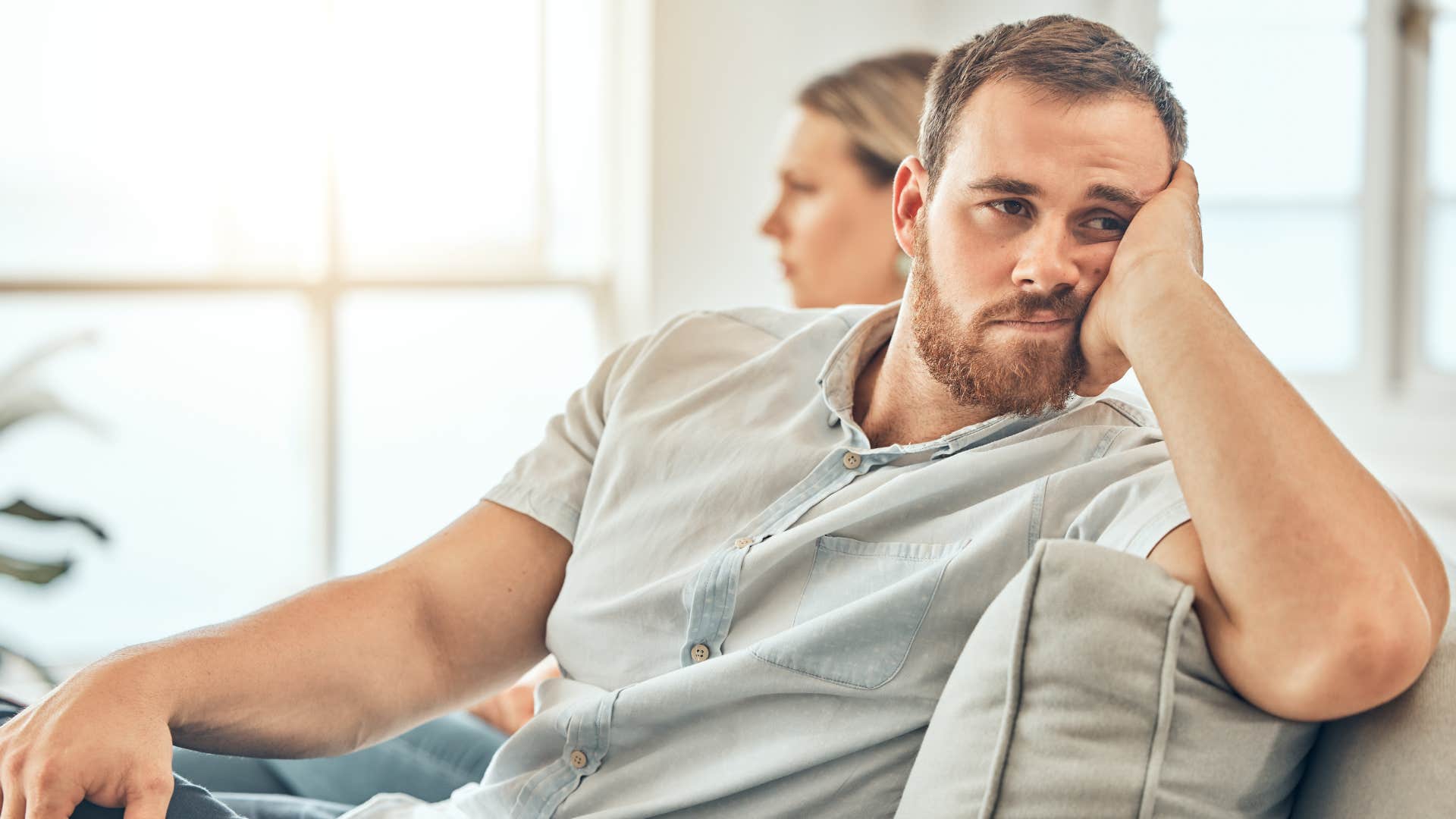 Man who stops making eye contact turned away from his wife.