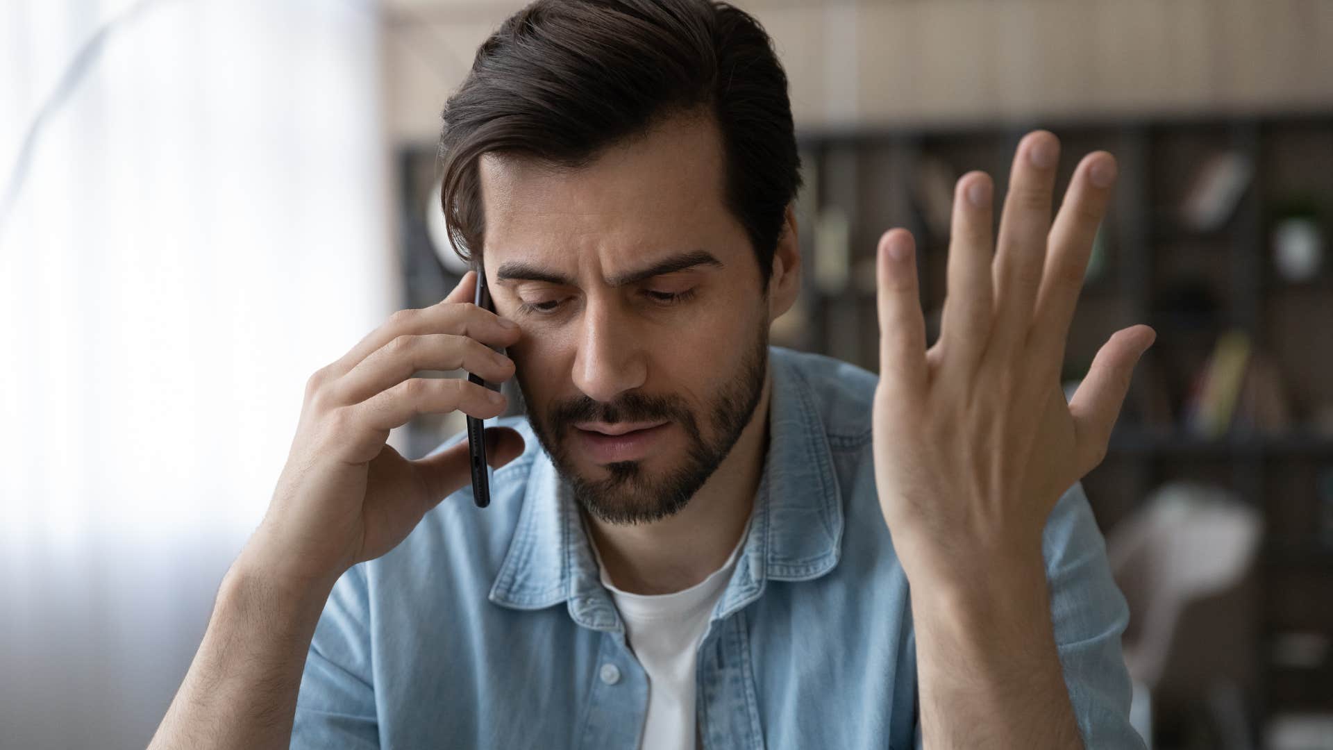 Man saying "it is what it is" on the phone.