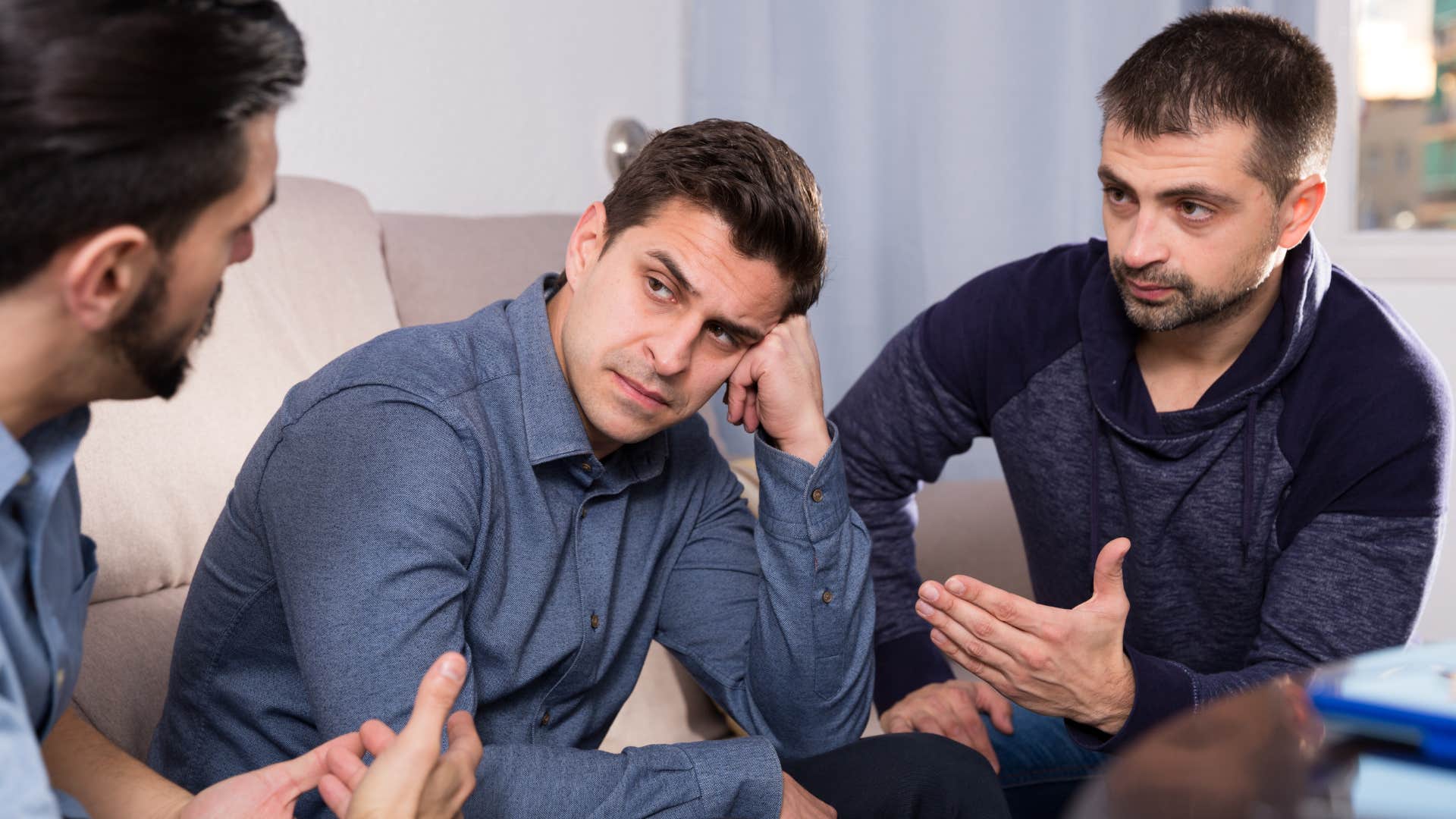 Man saying "she's so needy" to his friends.