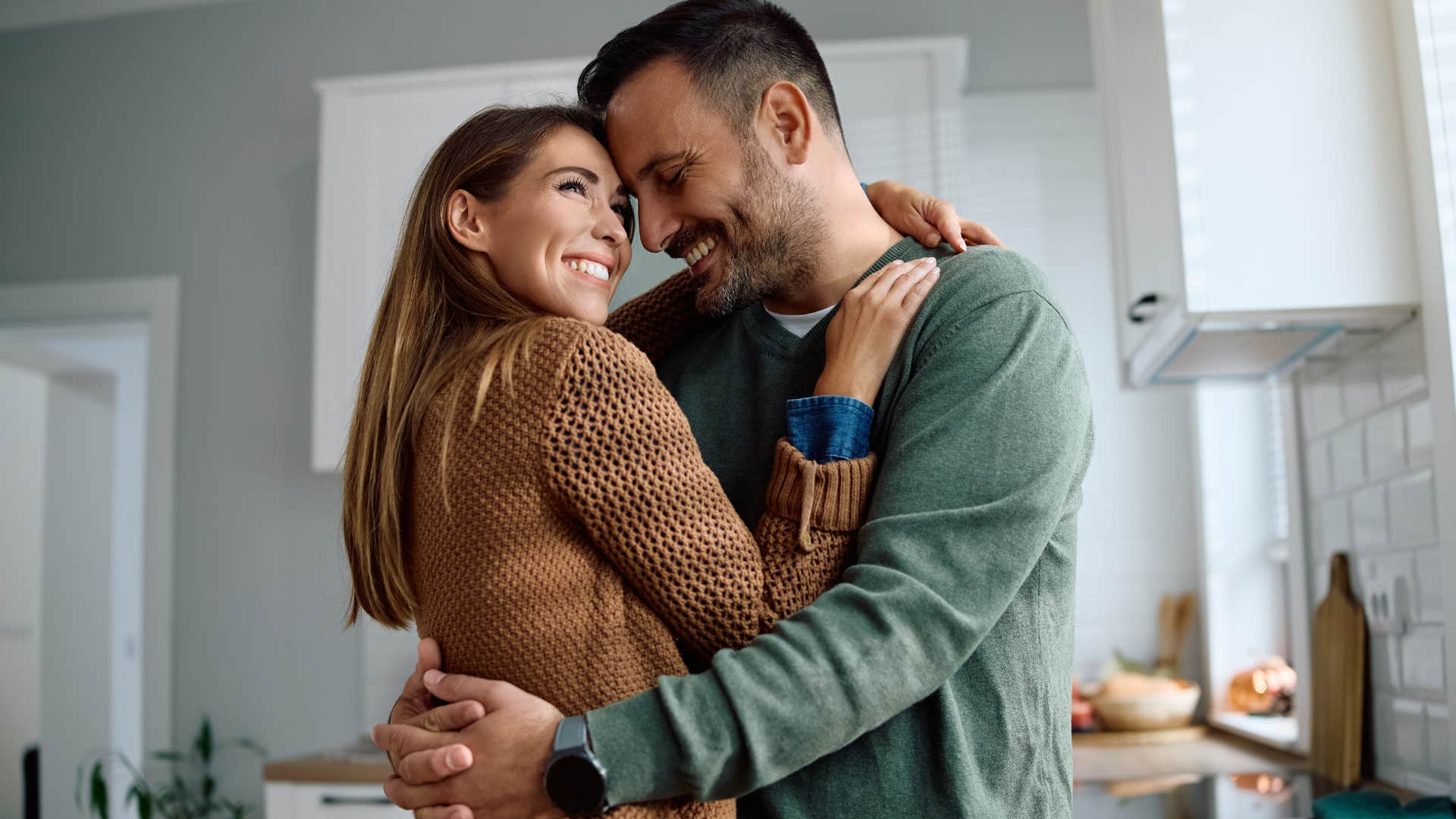 Man saying "I love you" to his partner at home.