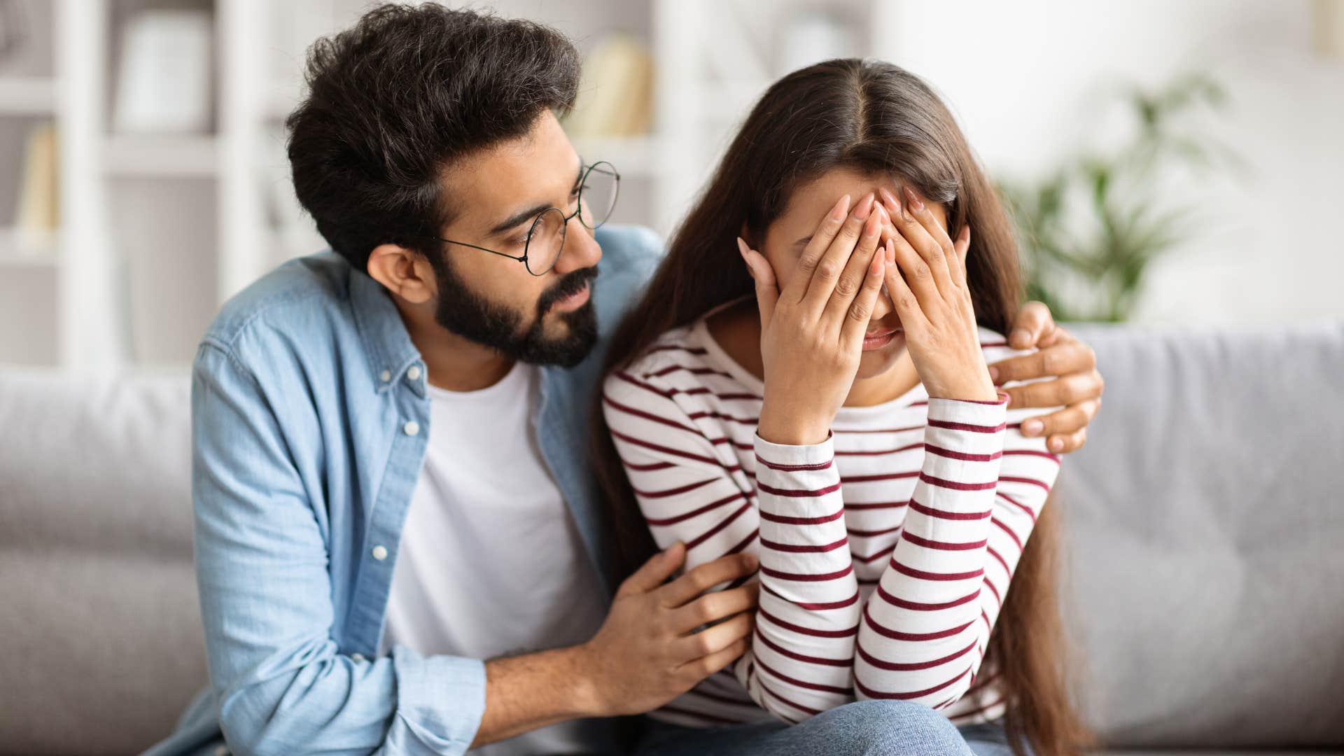 Man comforting his wife and saying "I'm here for you."