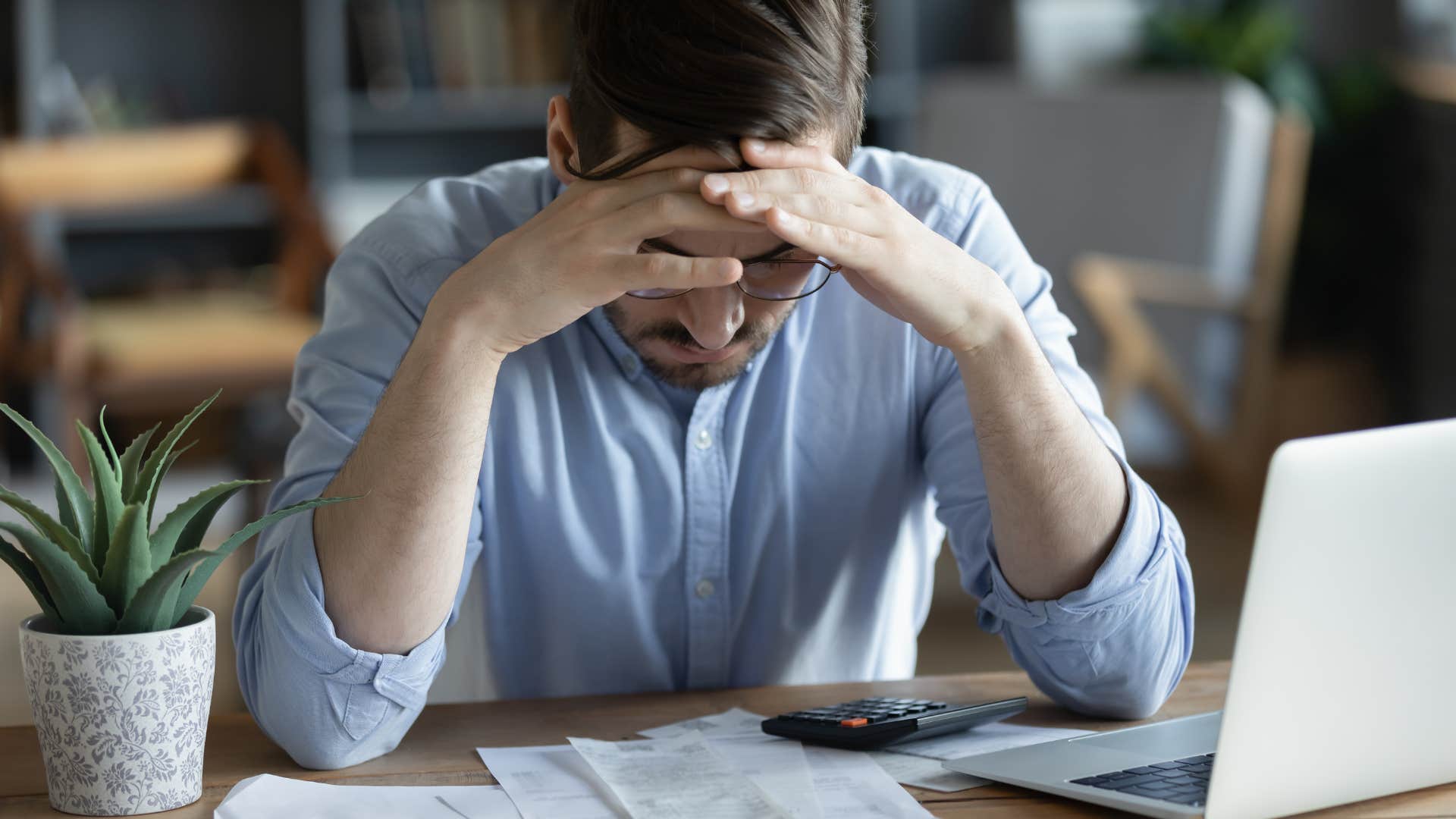 sad man who brought his work home stressed out