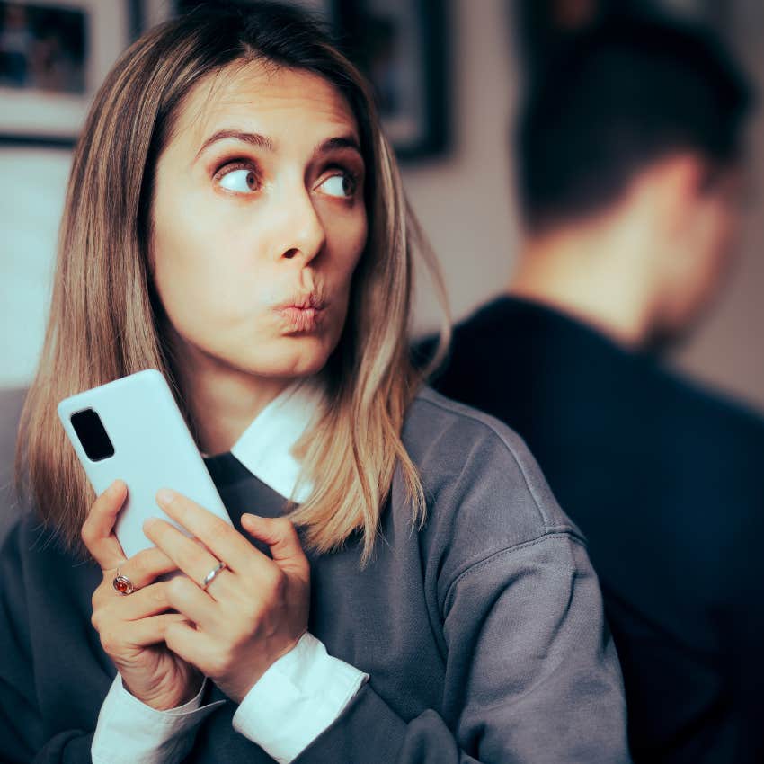 woman with really bad energy as she hides things