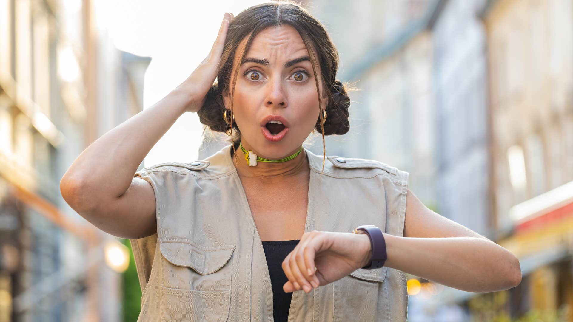 woman running late looking at her watch