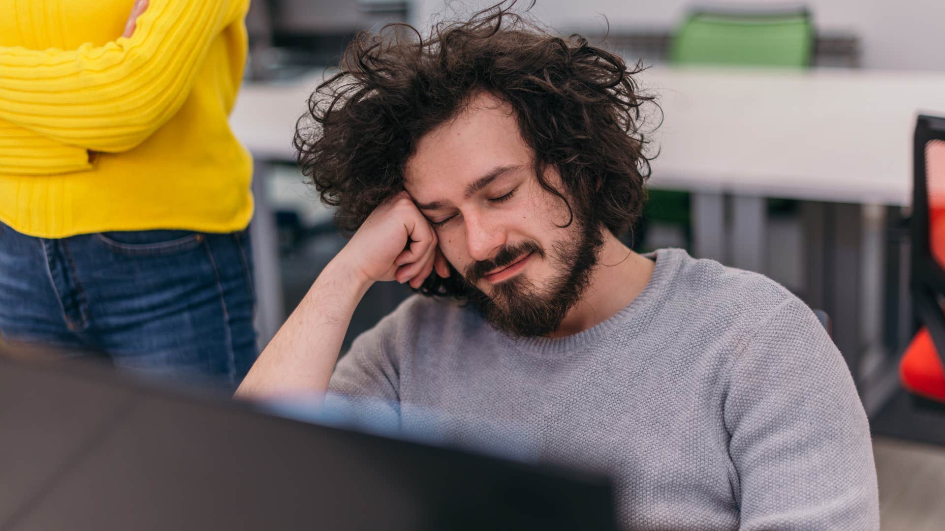 man who lacks ambition sleeping at work