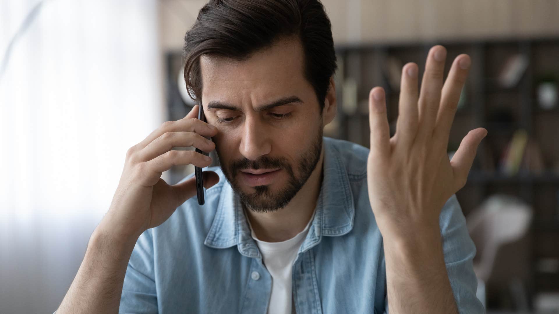 man not taking accountability talking on the phone