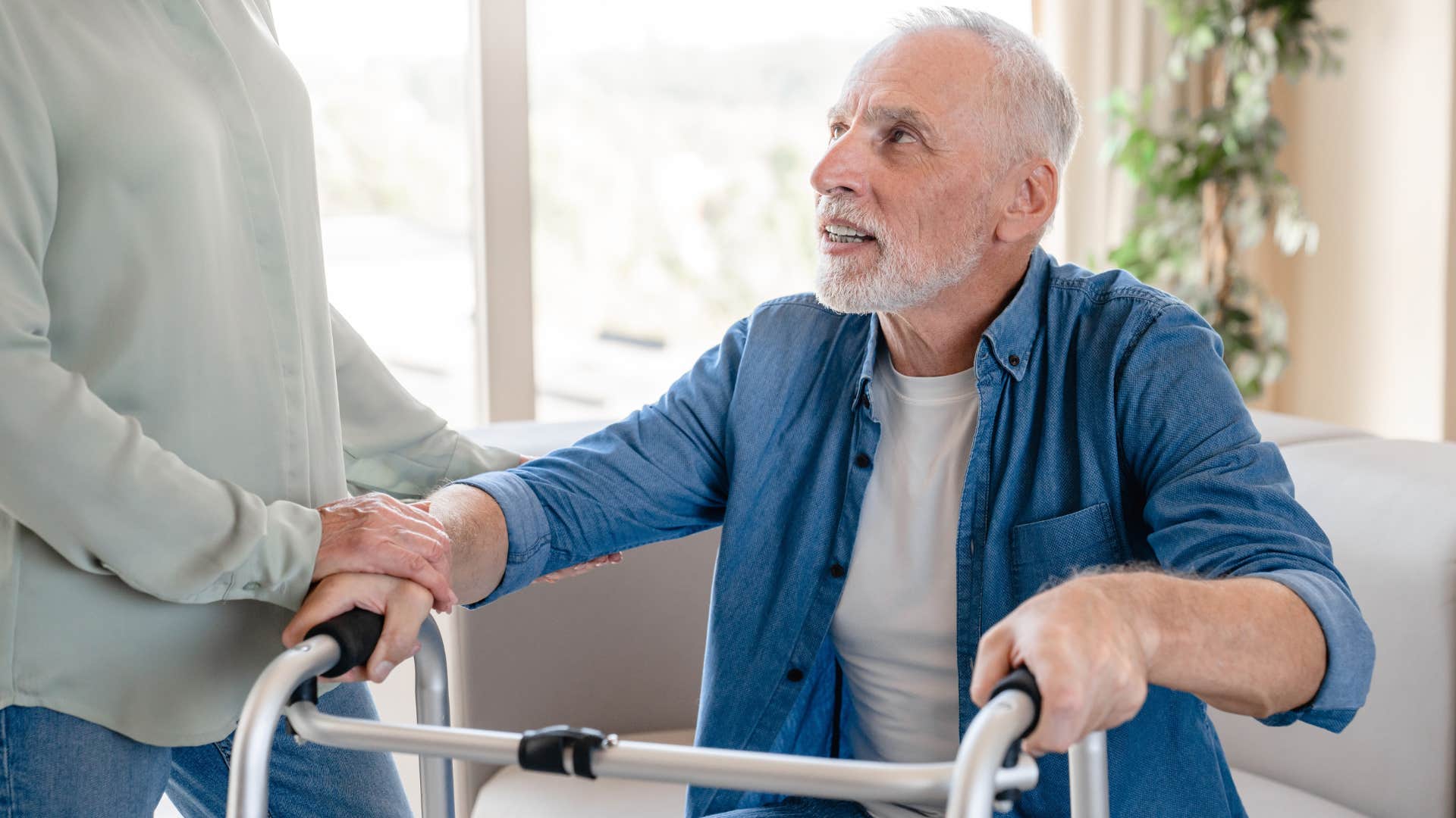 Man who's struggling to get around talking to his adult daughter.