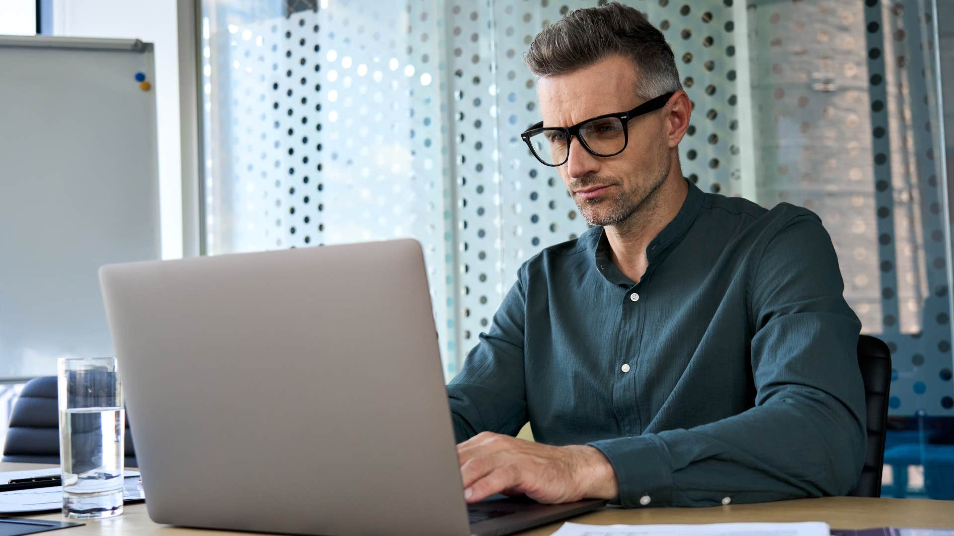 Man who avoids shortcuts working in an office.