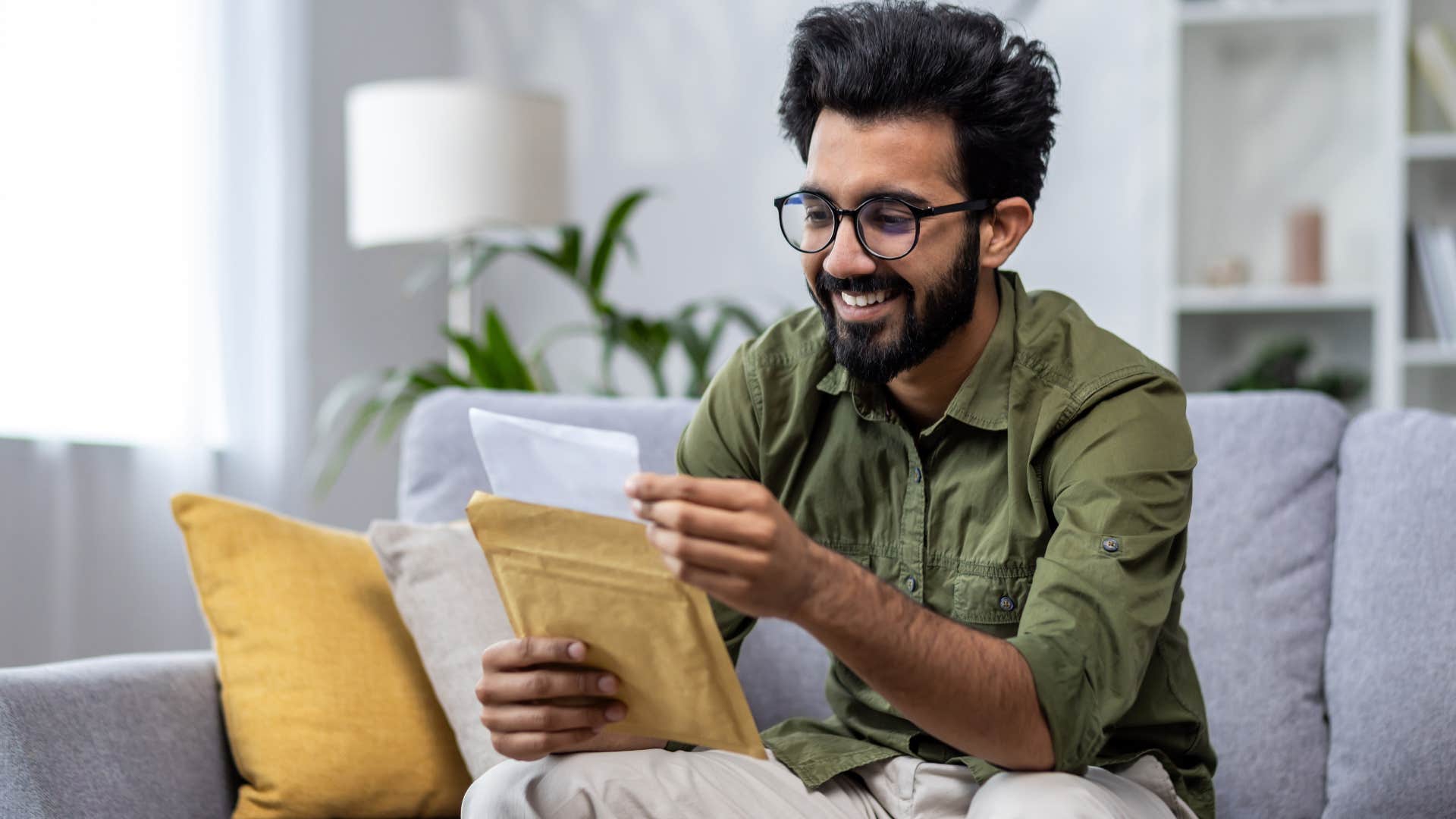 man receiving a letter in the mail