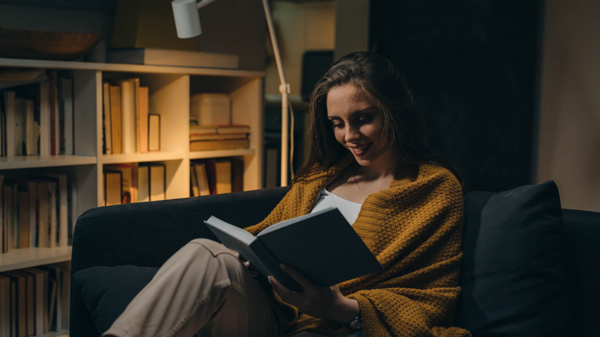 woman reading with low lighting