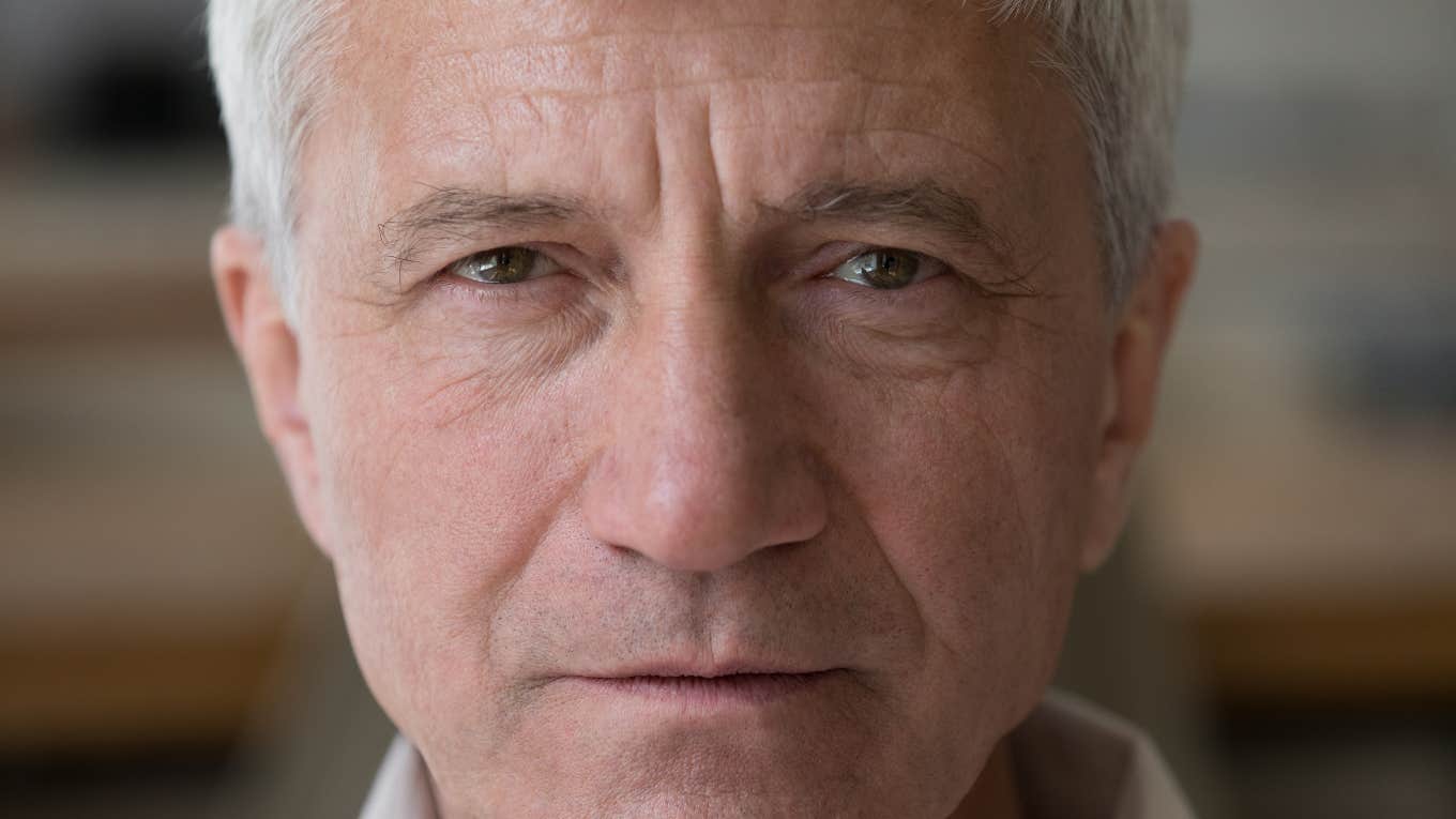 If Your Parents Say These Things Often, They're Struggling More Than They Admit older man looking sad struggling with mental health