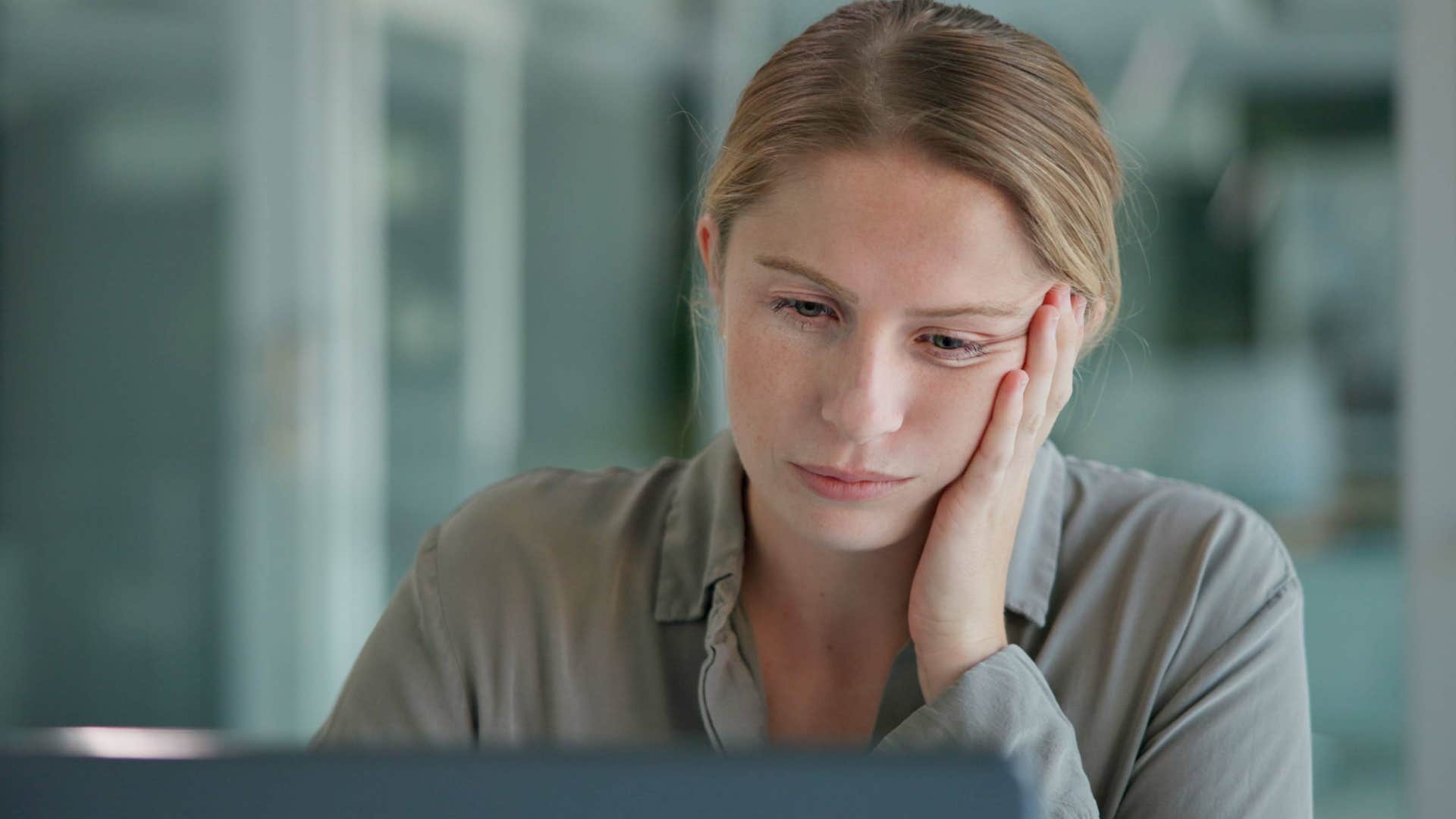 Woman who can avoid responsibilities looking at her laptop.