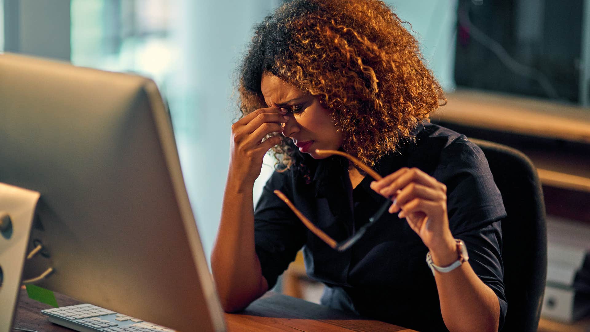 Woman who feels numb looking at her laptop.