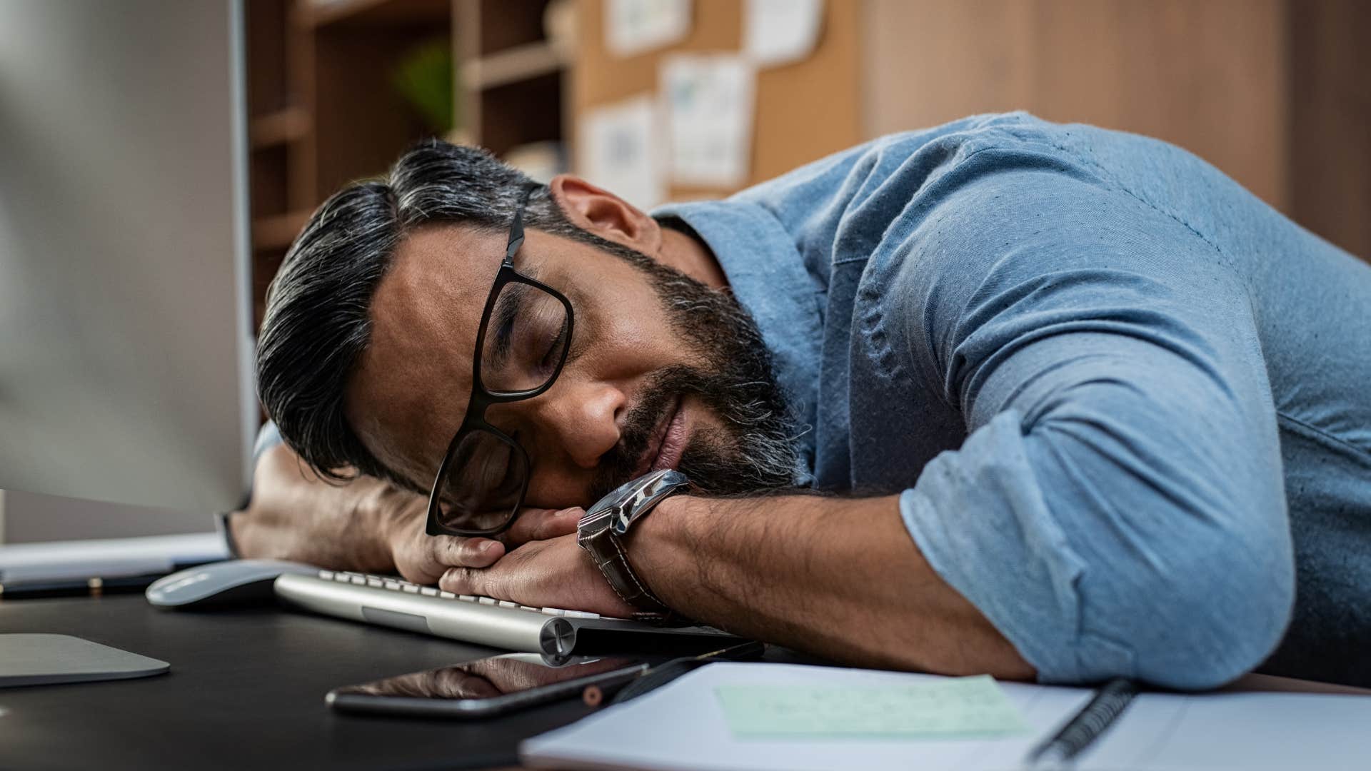 Man who takes extra long breaks laying on his computer.