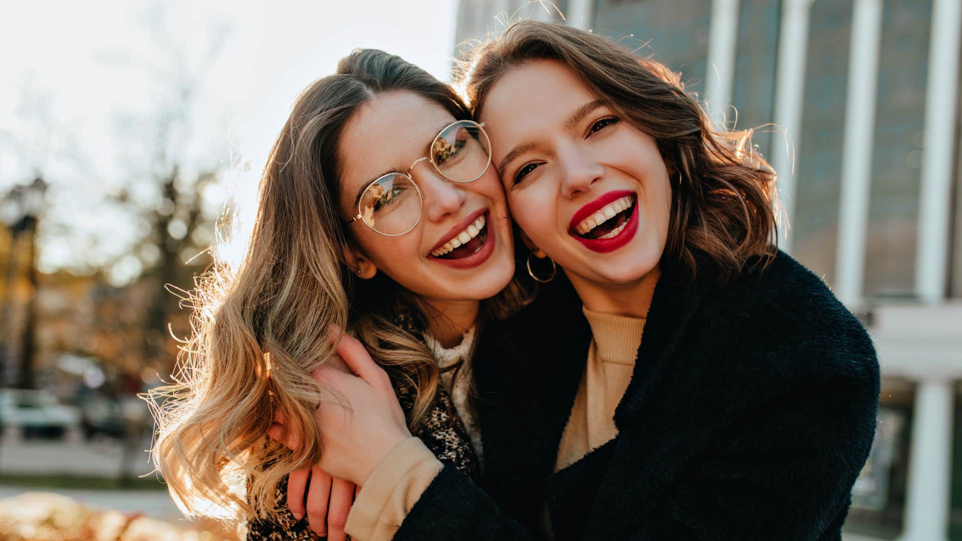 single mom hugging best friend who isnt a parent