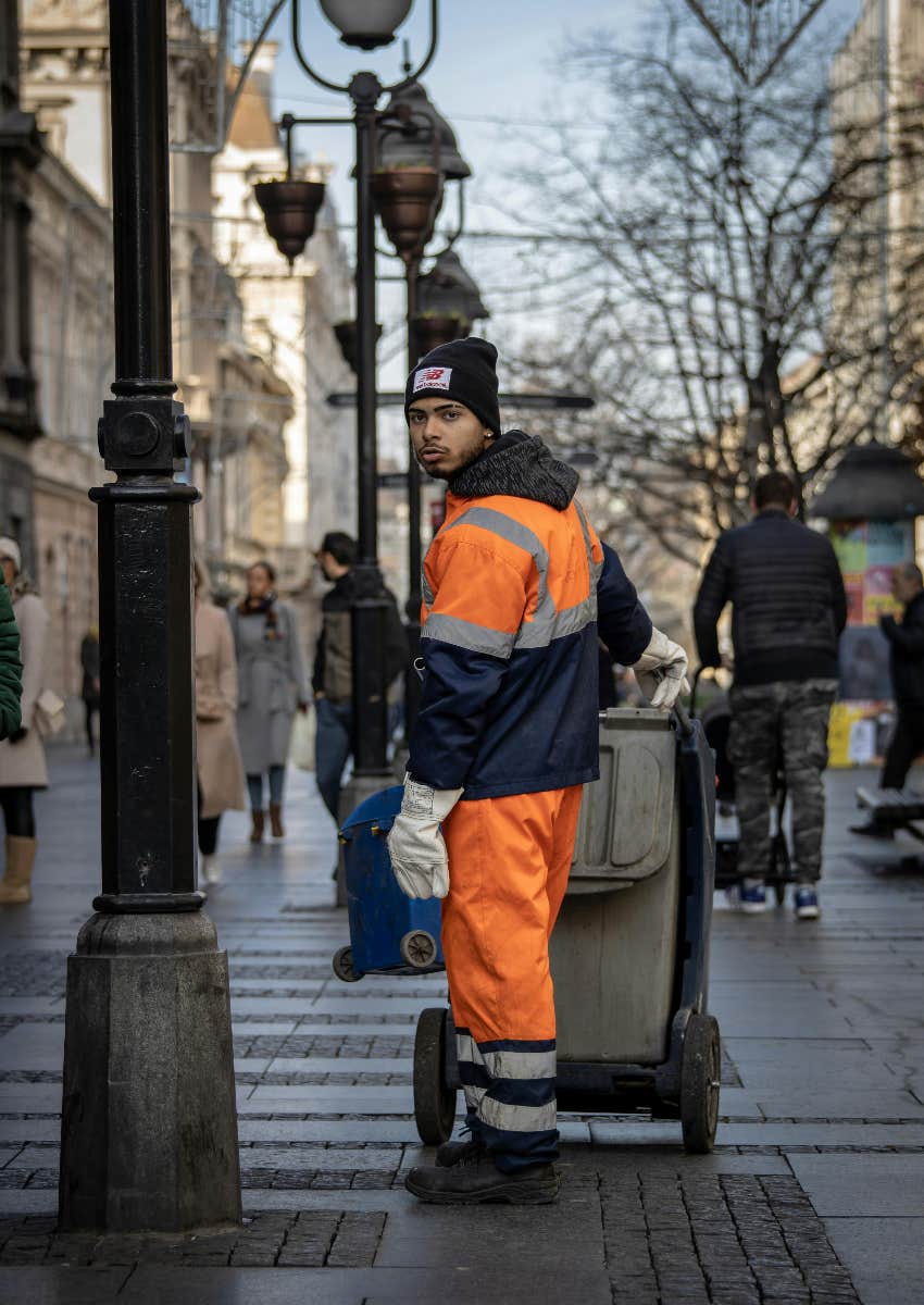 garbage collector on a city street