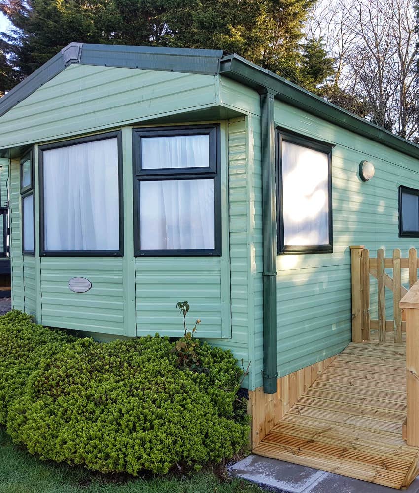 Man chose to use his inheritance to buy a home in a trailer park and his friends are criticizing him