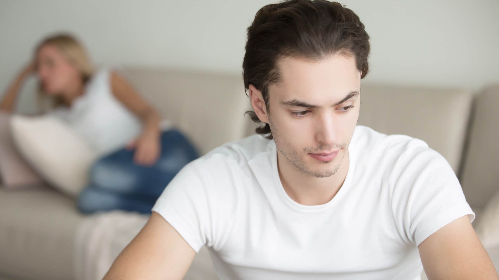 Man who avoids arguments turned away from his wife.