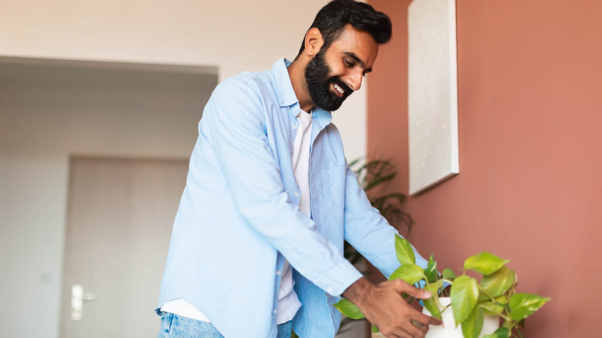 man decorating his room in a personal way
