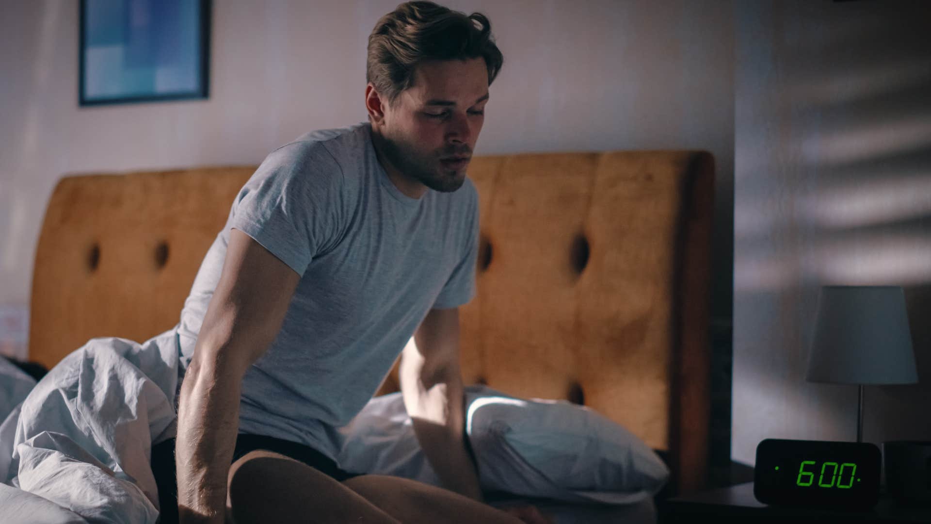 man who has different work schedules from his wife waking up early