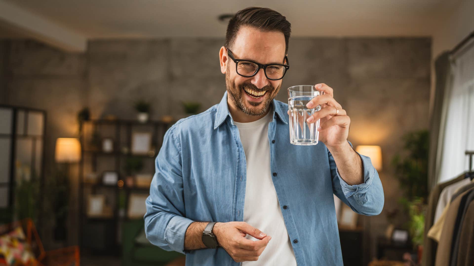 man holding glass of water