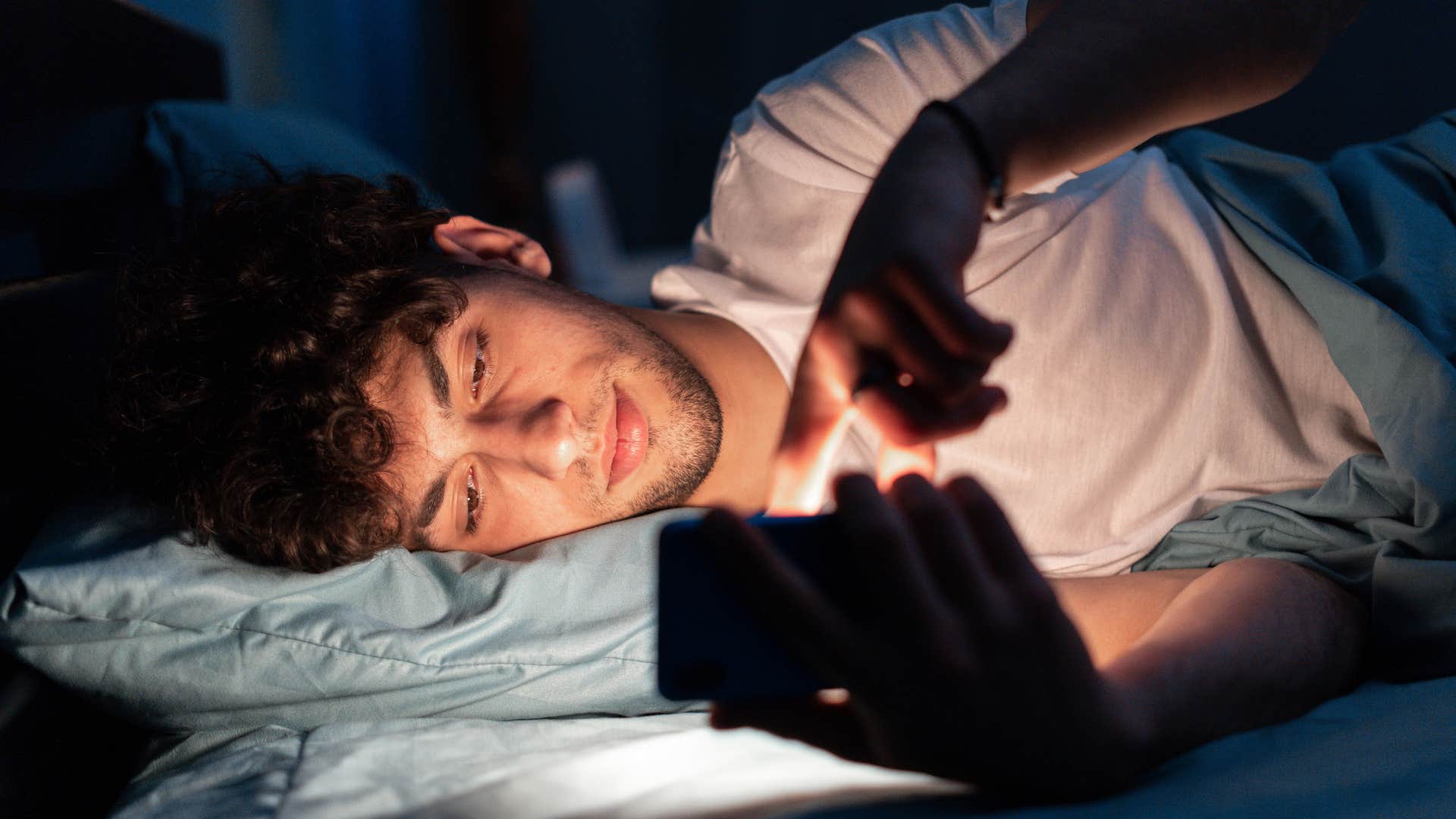 Man who can always go on their phone laying in bed.