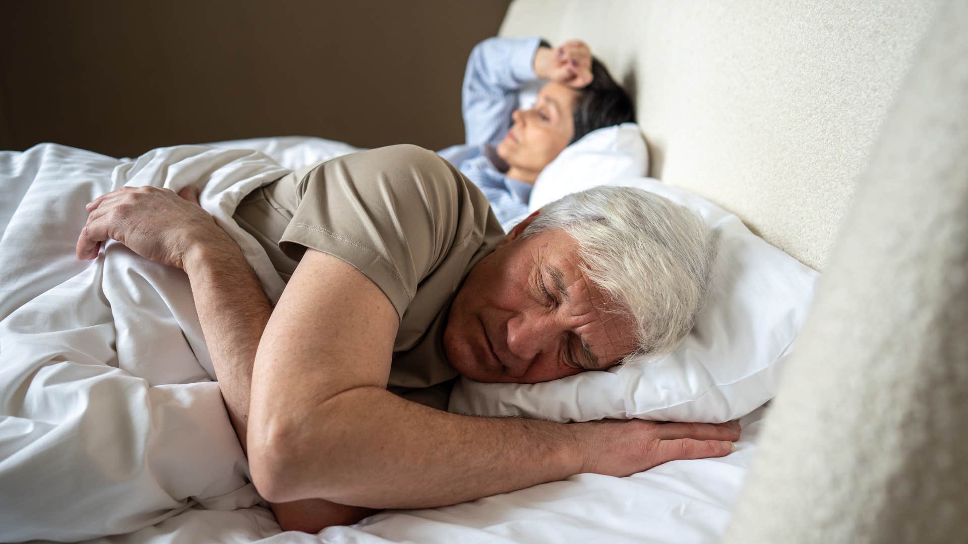 Man who creates physical space laying in bed.