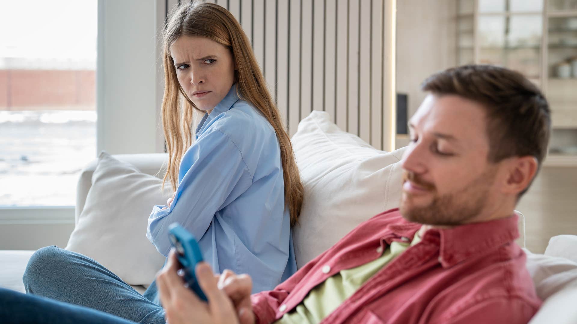 Woman glaring at her husband who doesn't plan dates.