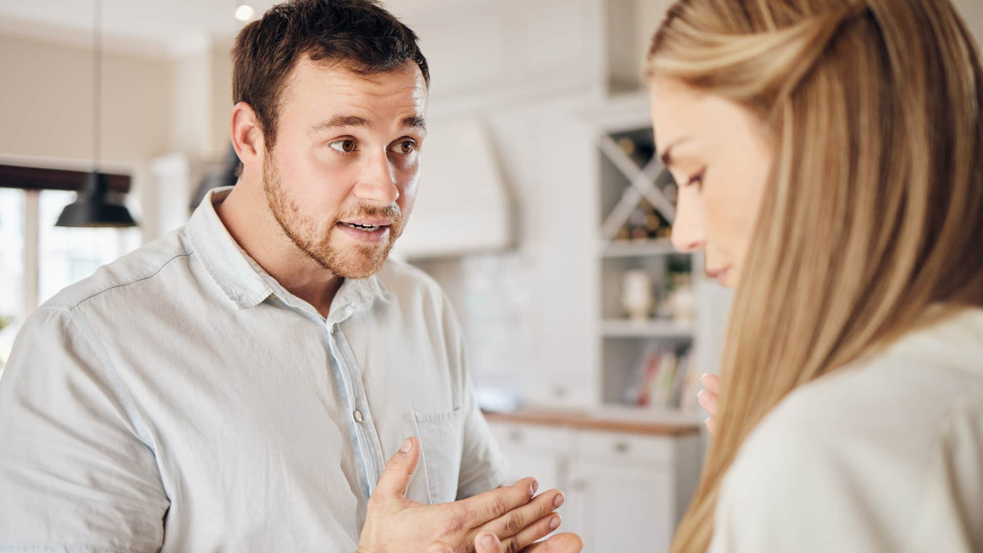 Man who makes everything into a petty argument looking at his wife.