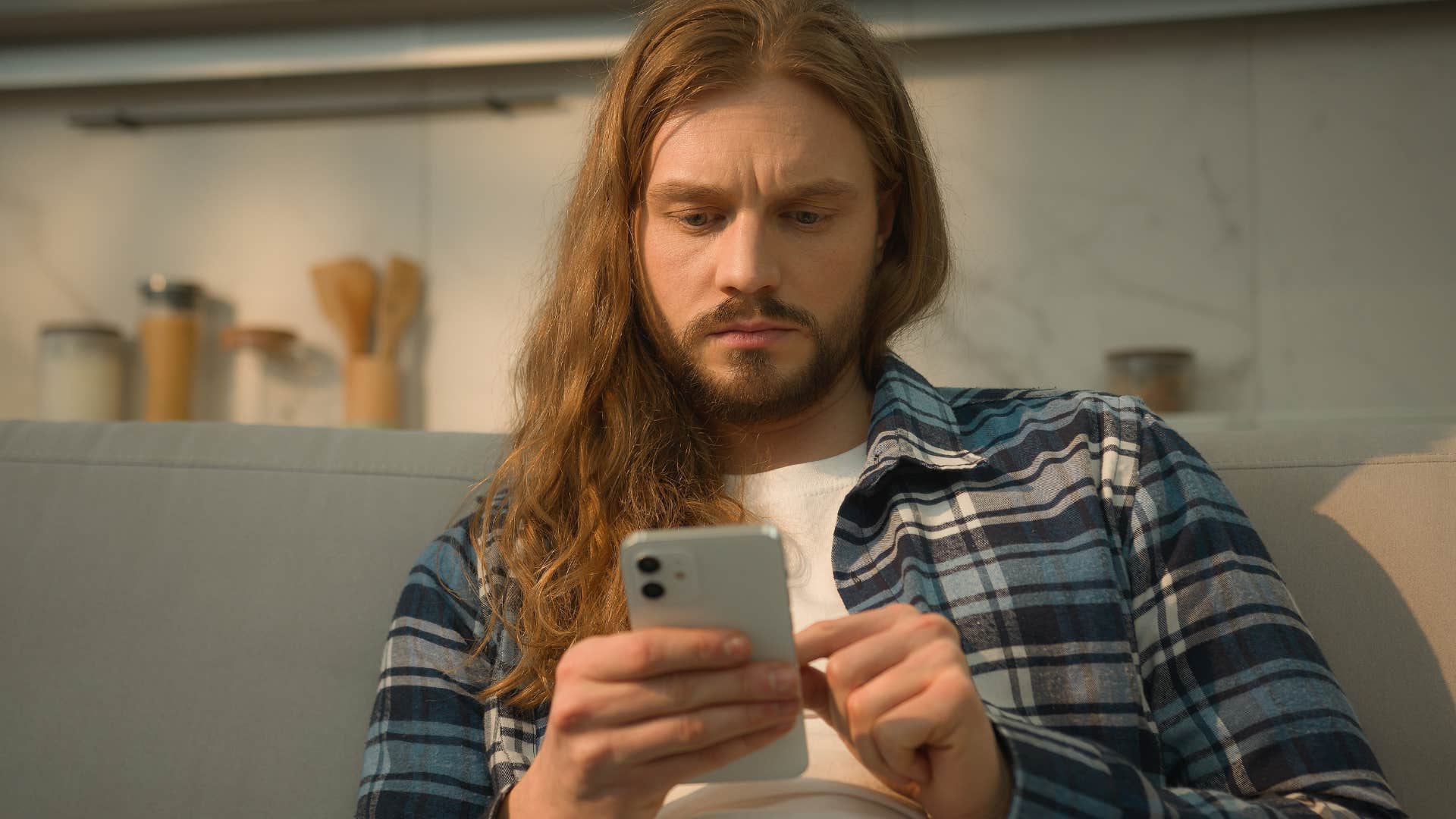 Man who spends tons of time alone looking at his phone.