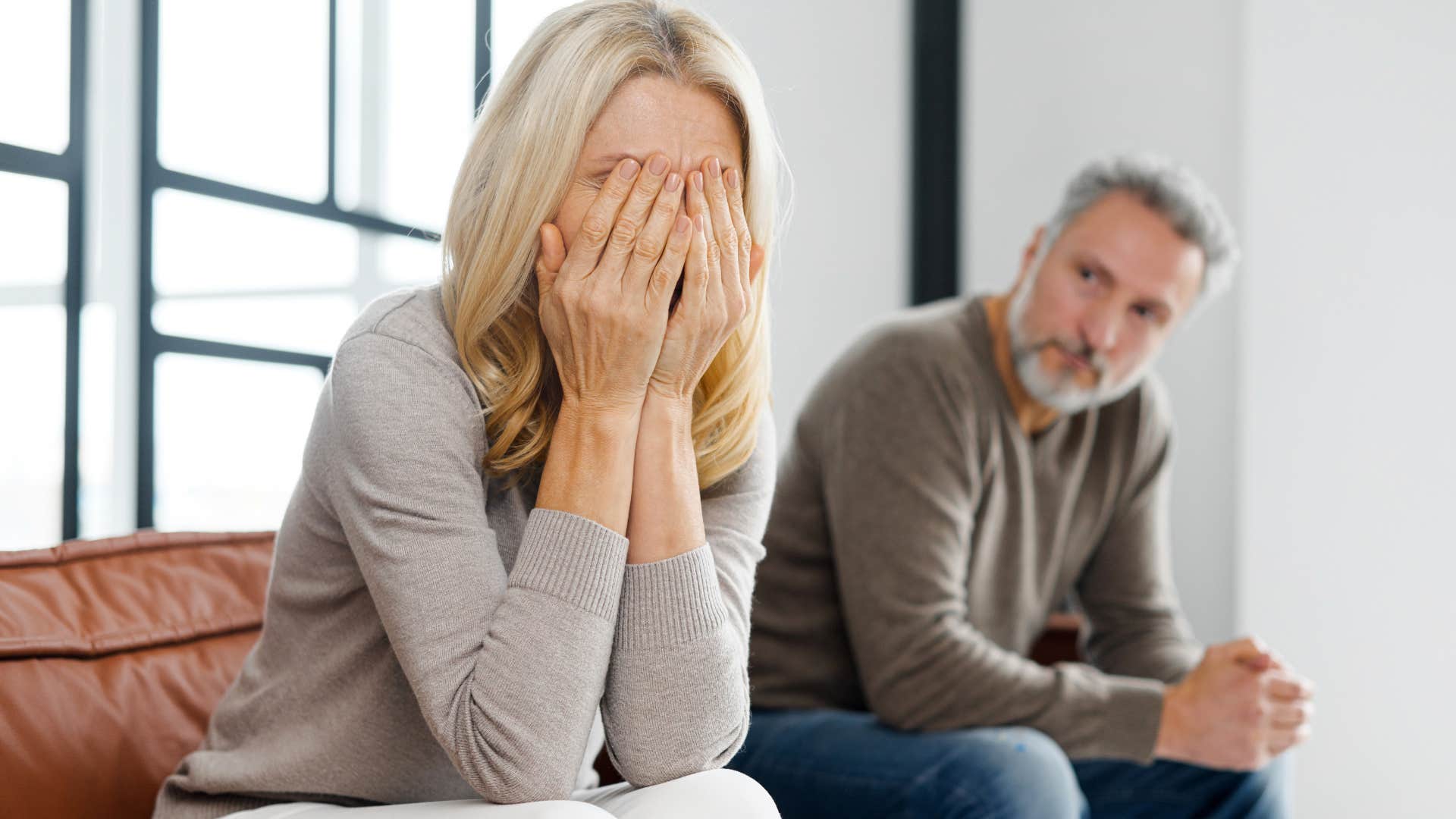 Man who can stop saying "I love you" looking at his upset wife.