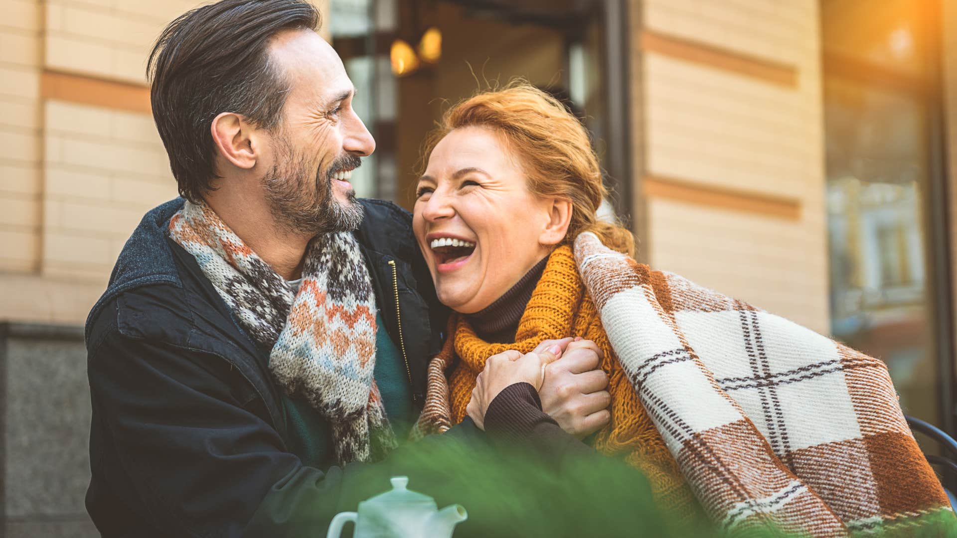 older couple who respects each other smiling and hugging