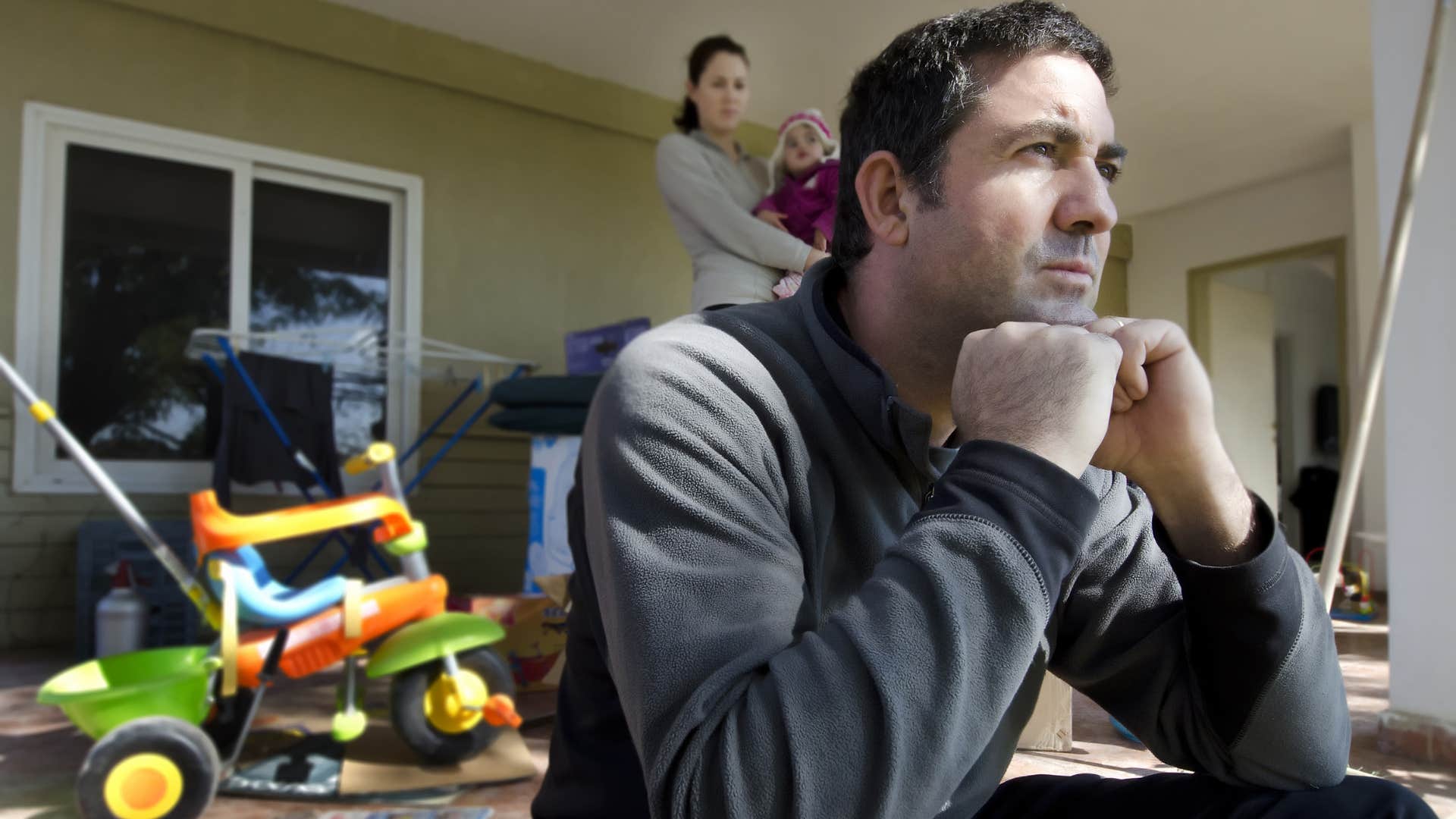 upset man saying I feel more like a roommate than a husband to his busy wife