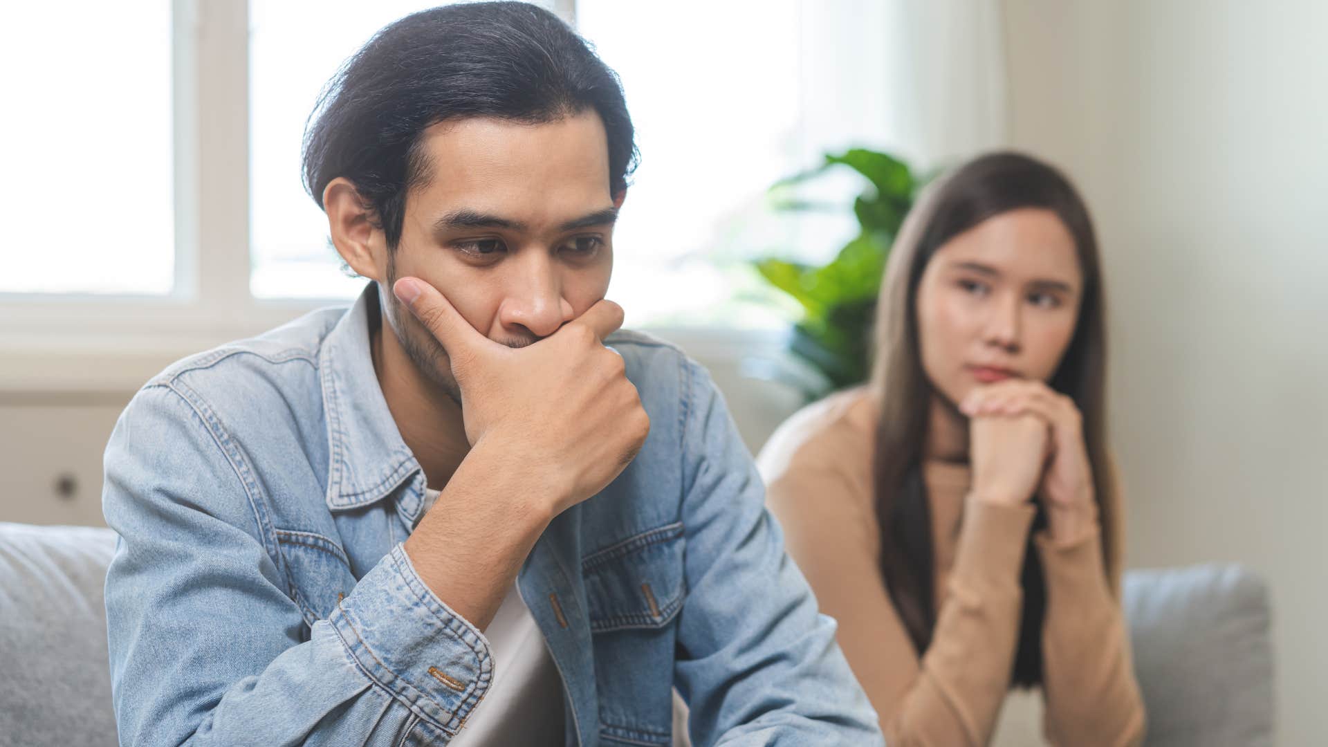 Couple who never has deep conversations sitting at home.