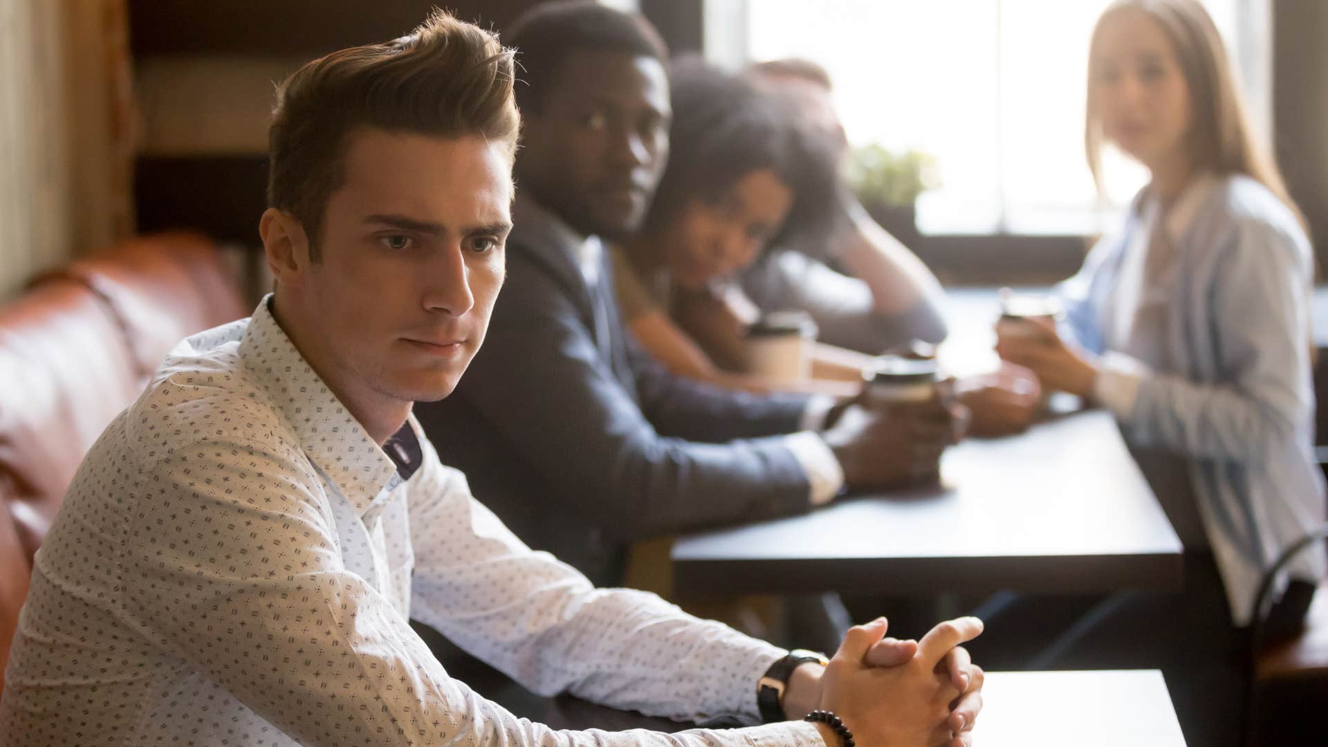 a man fears being rejected by a group of new people